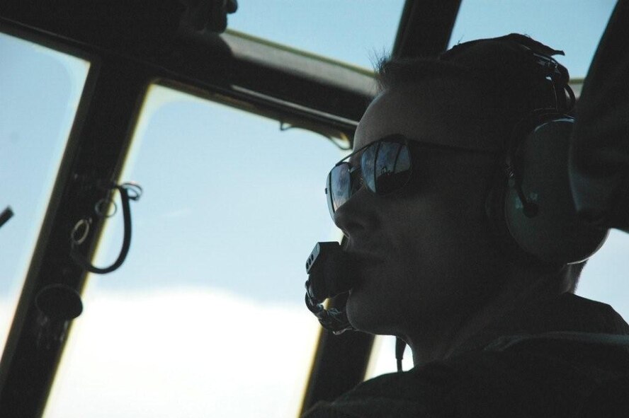 Capt. Jeff Negrette, 711th Special Operations Squadron pilot, monitors the controls during an MC-130E mission July 30.  The 919th launched more than 850 sorties and averaged more than 2,000 flight hours last year.  (U.S. Air Force photo/Staff Sgt. Jon McCallum.)