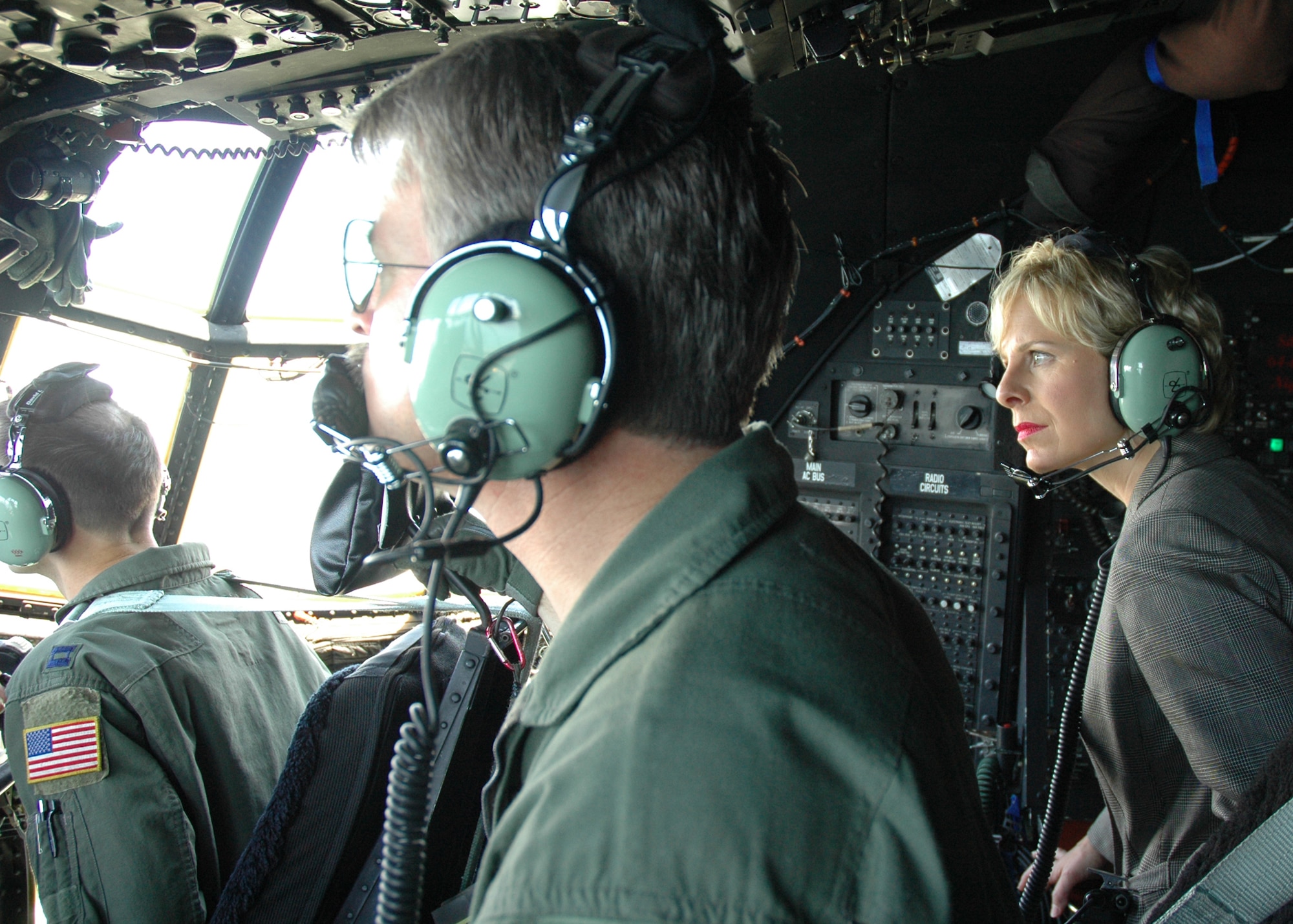Laura Hussey, a television reporter, looks out the windows of the cockpit of an AC-130 during a flight as part of the 919th’s Media Day July 30 at Duke Field.  Affiliates from print, television and radio came out for a tour of some of the base facilities and a flight in an MC-130.  (U.S. Air Force photo/Staff Sgt. Jon McCallum.) 