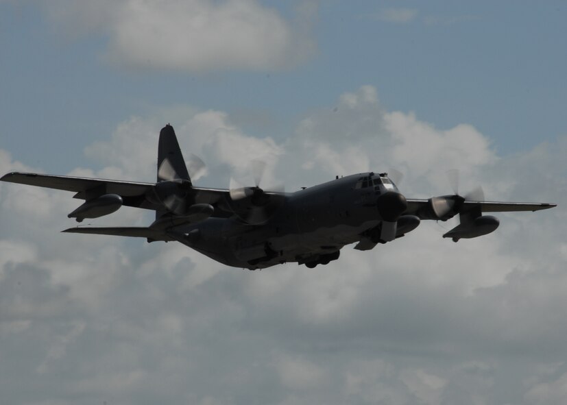 A 919th Special Operations Wing MC-130 passes over the Duke Field runway during a mission July 30.  The 919th launched more than 850 sorties and averaged more than 2,000 flight hours last year.  (U.S. Air Force photo/Staff Sgt. Samuel King Jr.)