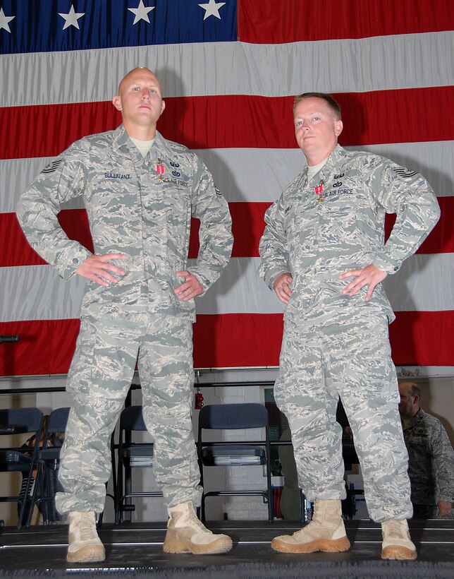 Tech. Sgt. Kevin Bullivant and Tech. Sgt. Barry Duffield from the 151st Air Refueling Wing, Utah Air National Guard, pose with their Bronze Stars in front of the American flag after an awards ceremony on August 1.  The sergeants were awarded the medals on August 1 for serving as team leaders in the 506th Explosive Ordnance Disposal (EOD) Flight while deployed to Kirkuk Air Base, Iraq.  The deployment was in support of Operation Iraqi Freedom. U.S. Air Force photo by Staff Sgt. Emily Monson.