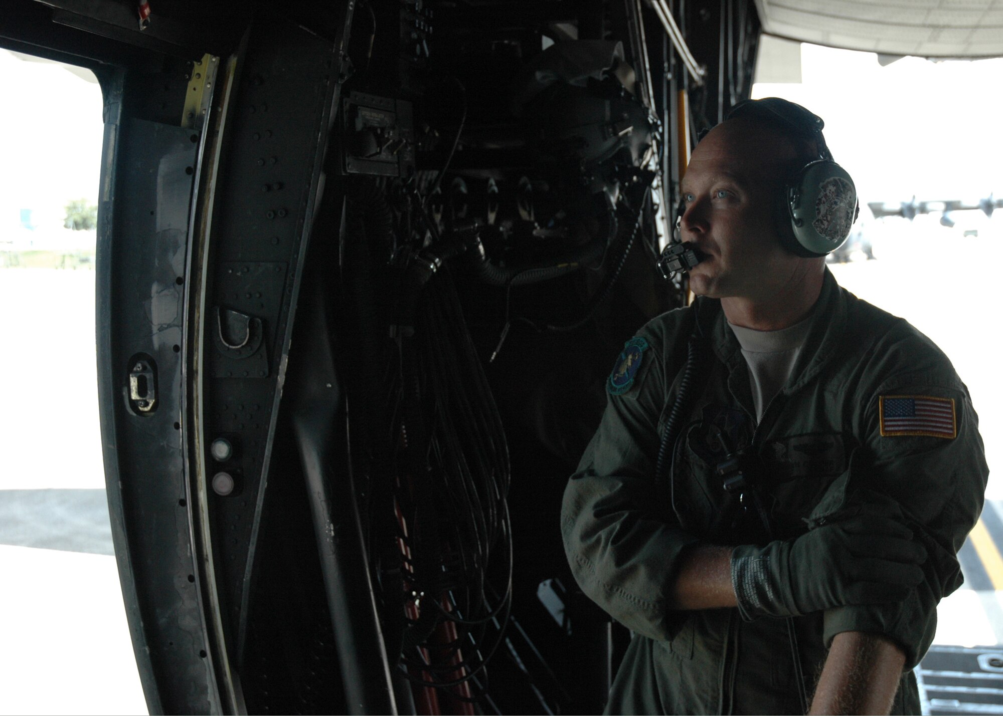 Staff Sgt. Shawn Cooper, 711th Special Operations Squadron loadmaster, watches the engines fire up before closing the doors before an MC-130 sortie July 30.  The 919th launched more than 850 sorties and averaged more than 2,000 flight hours last year.  (U.S. Air Force photo/Staff Sgt. Jon McCallum.)