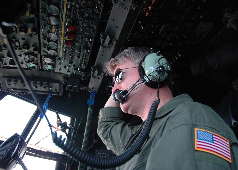 Senior Master Sgt. Doug McDavid, 711th Special Operations Squadron flight engineer, performs in-flight duties during an MC-130 mission July 30.  The 919th launched more than 850 sorties and averaged more than 2,000 flight hours last year.  (U.S. Air Force photo/Staff Sgt. Jon McCallum.)