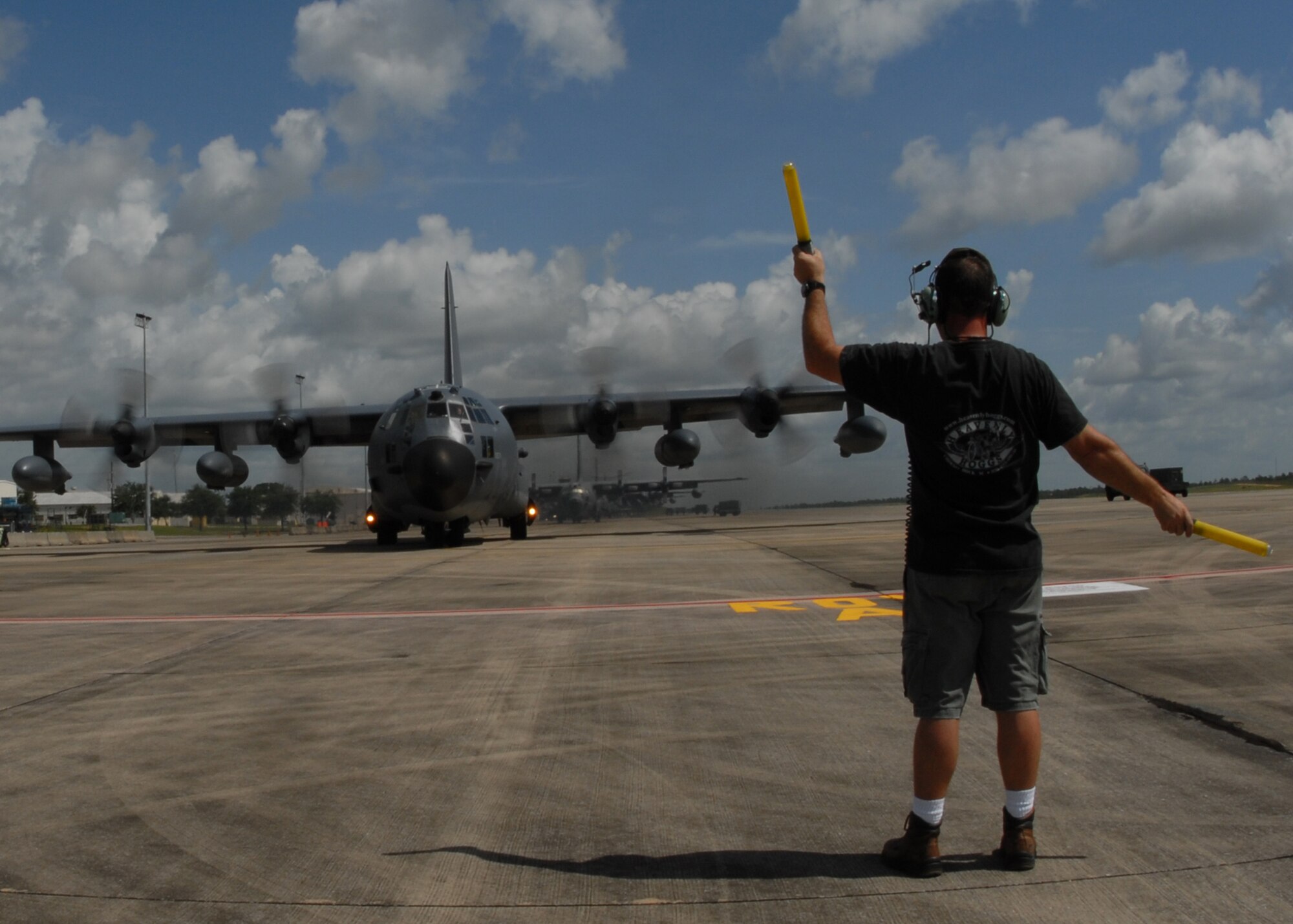 Mike Zukusky, 919th Aircraft Maintenance Squadron crew chief, directs the pilot to turn the MC-130 as it taxis to the runway for a mission July 30 at Duke Field. The 919th launched more than 850 sorties and averaged more than 2,000 flight hours last year.  (U.S. Air Force photo/Staff Sgt. Samuel King Jr.)