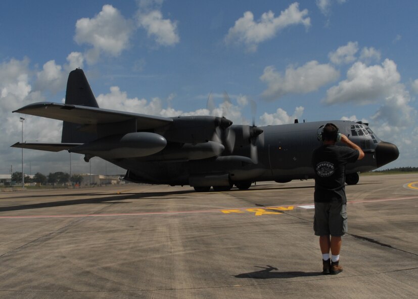 Mike Zukusky, 919th Aircraft Maintenance Squadron crew chief, salutes the pilot of the MC-130 as it taxis to the runway for a mission July 30 at Duke Field. The 919th launched more than 850 sorties and averaged more than 2,000 flight hours last year.  (U.S. Air Force photo/Staff Sgt. Samuel King Jr.)