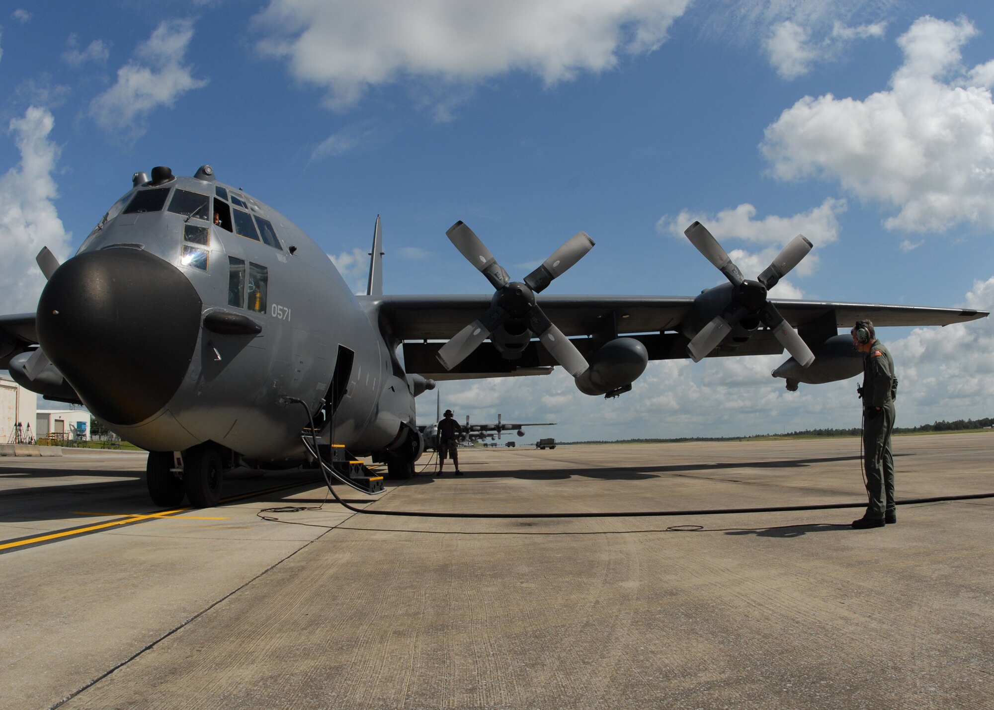 A 919th Special Operations Wing loadmaster talks with an MC-130 pilot prior to a mission July 30 at Duke Field.  The 919th launched more than 850 sorties and averaged more than 2,000 flight hours last year.  (U.S. Air Force photo/Staff Sgt. Samuel King Jr.)