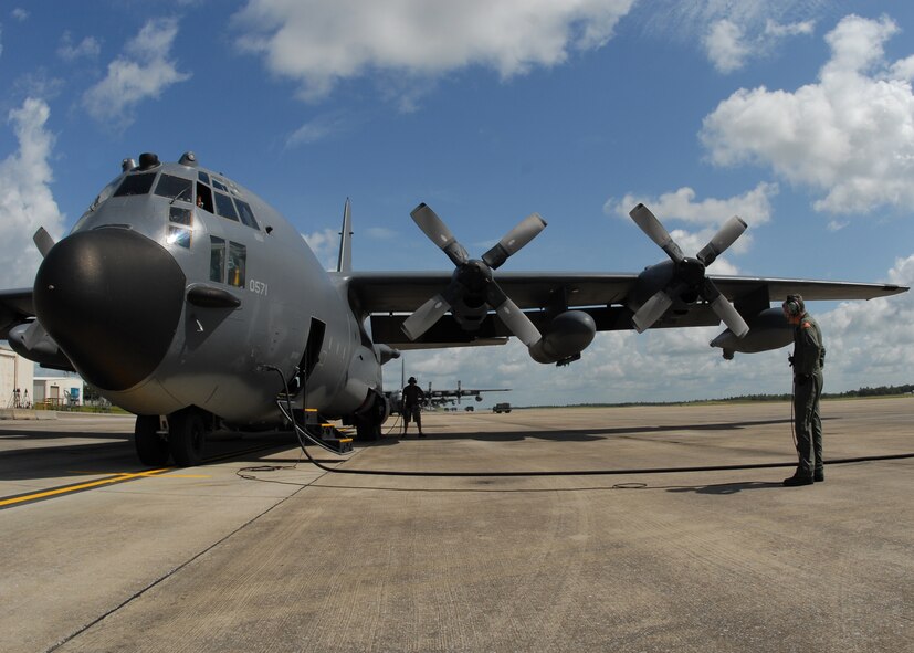 A 919th Special Operations Wing loadmaster talks with an MC-130 pilot prior to a mission July 30 at Duke Field.  The 919th launched more than 850 sorties and averaged more than 2,000 flight hours last year.  (U.S. Air Force photo/Staff Sgt. Samuel King Jr.)