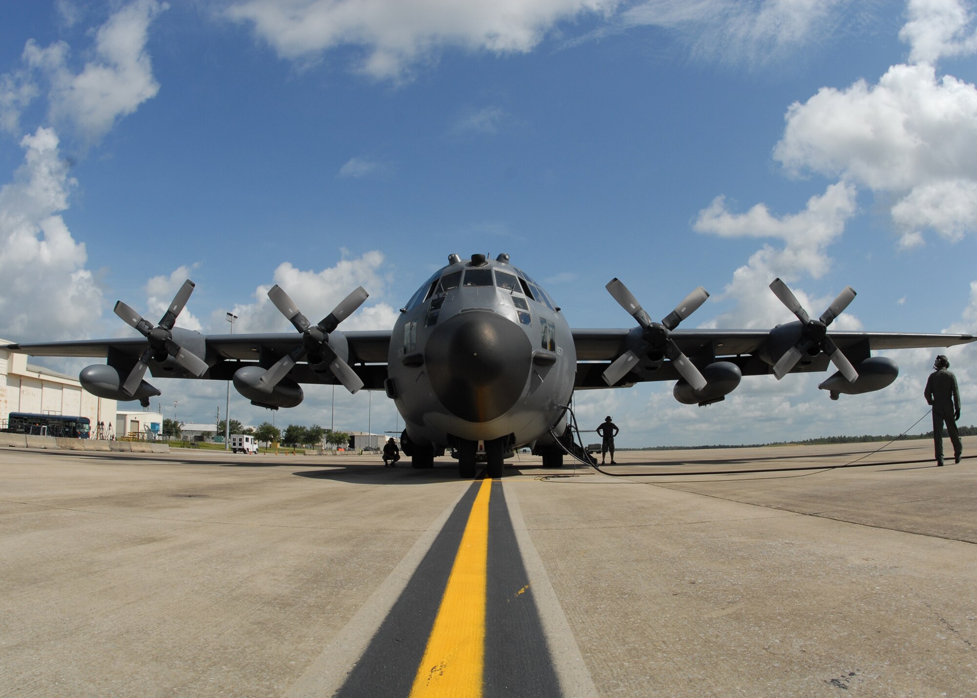 A 919th Special Operations Wing loadmaster walks around an MC-130 prior to a mission July 30 at Duke Field.  The 919th launched more than 850 sorties and averaged more than 2,000 flight hours last year.  (U.S. Air Force photo/Staff Sgt. Samuel King Jr.)