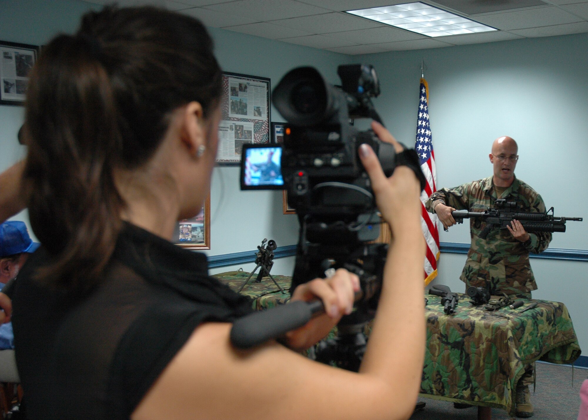 Master Sgt. William Stapp, 919th Security Forces Squadron, demonstrates the types of weapons used in special operations during the 919th’s Media Day July 30 at Duke Field.  Affiliates from print, television and radio came out for a tour of some of the base facilities and a flight in an MC-130.  (U.S. Air Force photo/Staff Sgt. Jon McCallum.) 