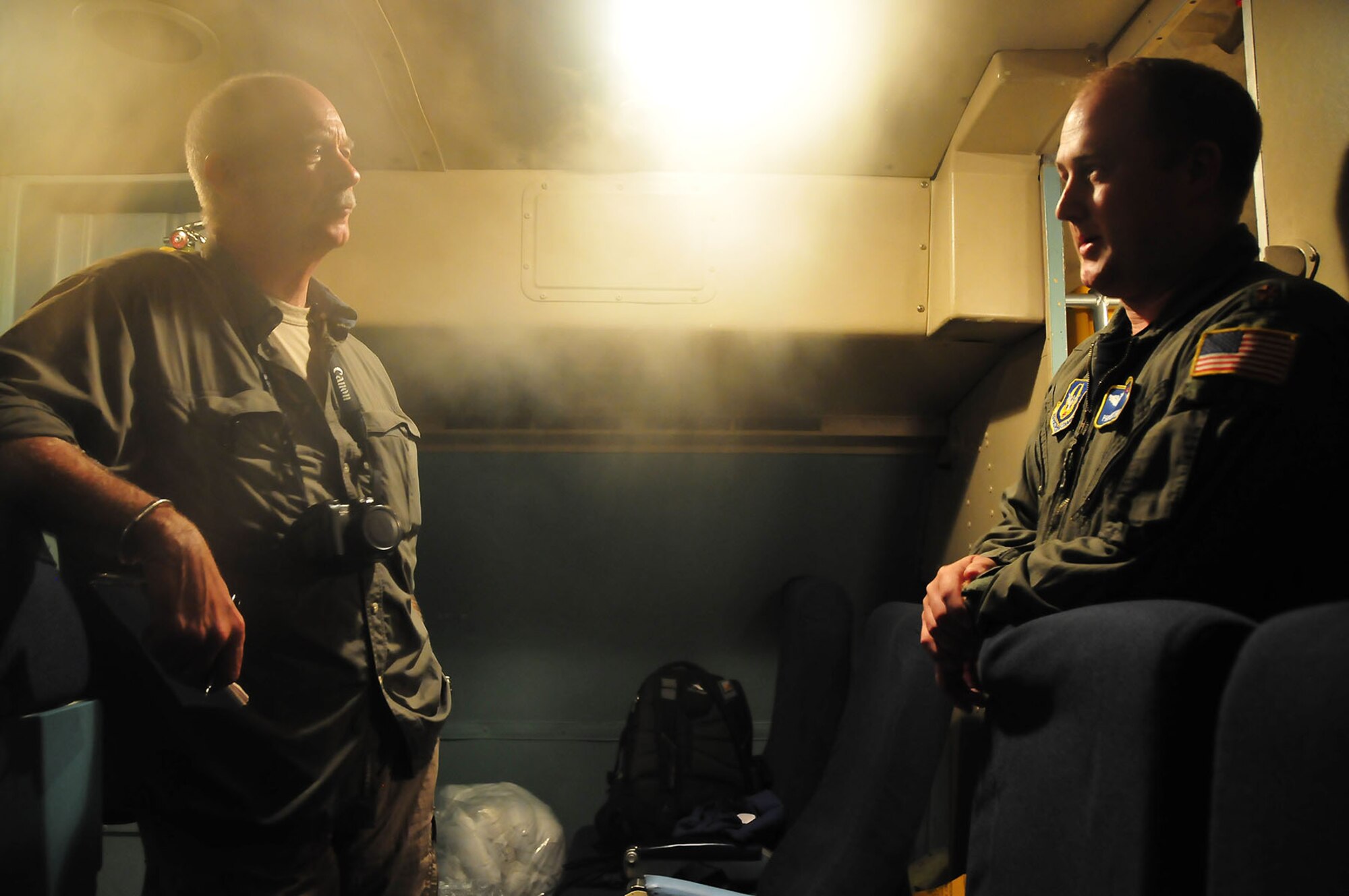 Maj. Phill Chestnut and Mr. David Wood discuss the capabilities of the C-5 Galaxy while on-board the aircraft at Charleston Air Force Base, N.C., July 31.  Mr. Wood is a reporter covering the air mobility mission, and the C-5 and its crew are transporting two Mine Resistant Ambush Protected vehicles and support equipment to Afghanistan in support of Operation Enduring Freedom.  The mission was planned and scheduled by the 618th Tanker Airlift Control Center, at Scott AFB, Ill.  Major Chestnutt is assigned to the 439th Airlift Wing from Westover Air Reserve Base, Mass. (U.S. Air Force photo/Staff Sgt. Daniel Bowles)
