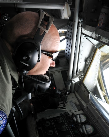 KC-135 boom-pod operator, Tech. Sgt. Tony Kalakis with the 151st Air Refueling Wing, watches the approach of a NATO E-3 AWACS above northern Germany July 29 during an air refueling training mission. The Utah Air National Guard is deployed for a two-week rotation to participate in the AWACS air refueling training at the Geilenkirchen Air Base in Germany. U. S. Air Force photo by Airman 1st Class Lillian Chatwin. 