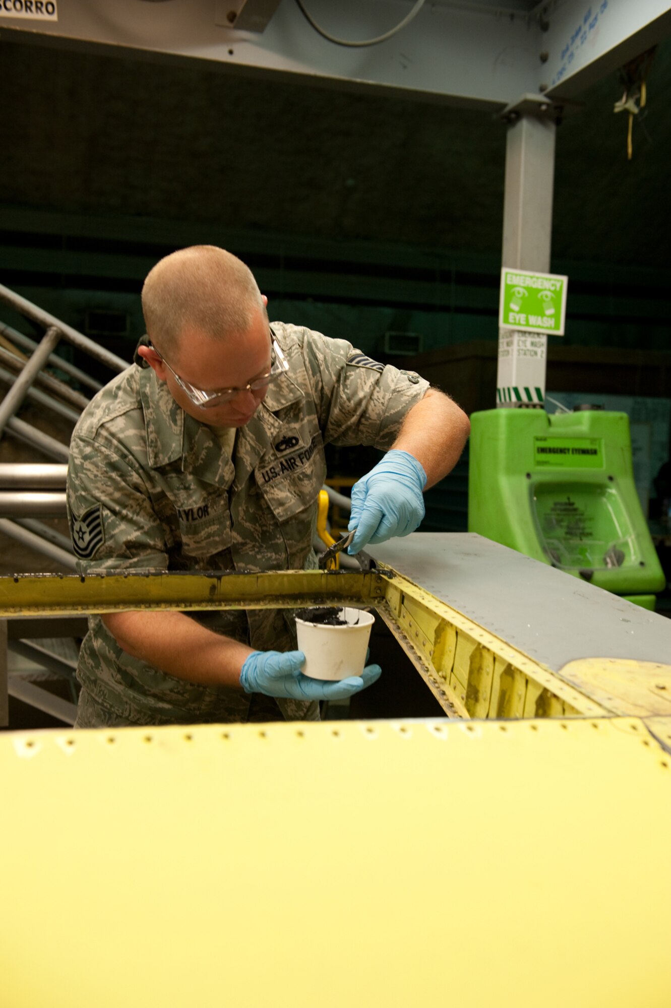Tech. Sgt. Jack Taylor, 379th Expeditionary Maintenance Squadron aircraft structural maintainer, applies sealer prior to rivoting a KC-135 Stratotanker aileron, July 27, in Southwest Asia. The 379 EMXS fabrication flight has the ability to construct or repair almost any avionic part, keeping the aircraft flying and maintaining mission readiness. Taylor is a native of Fultondale, Ala., and is deployed from Charleston Air Force Base, S.C., in support of Operations Iraqi and Enduring Freedom. (U.S. Air Force Photo/Staff Sgt. Robert Barney)