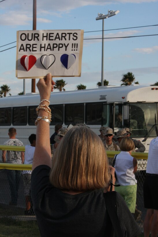 Marines and sailors of 1st Battalion, 7th Marine Regiment, are welcomed home by cheering friends and family during their homecoming ceremony at Victory Field Aug. 3. More than 300 returned from Fallujah, Iraq.
