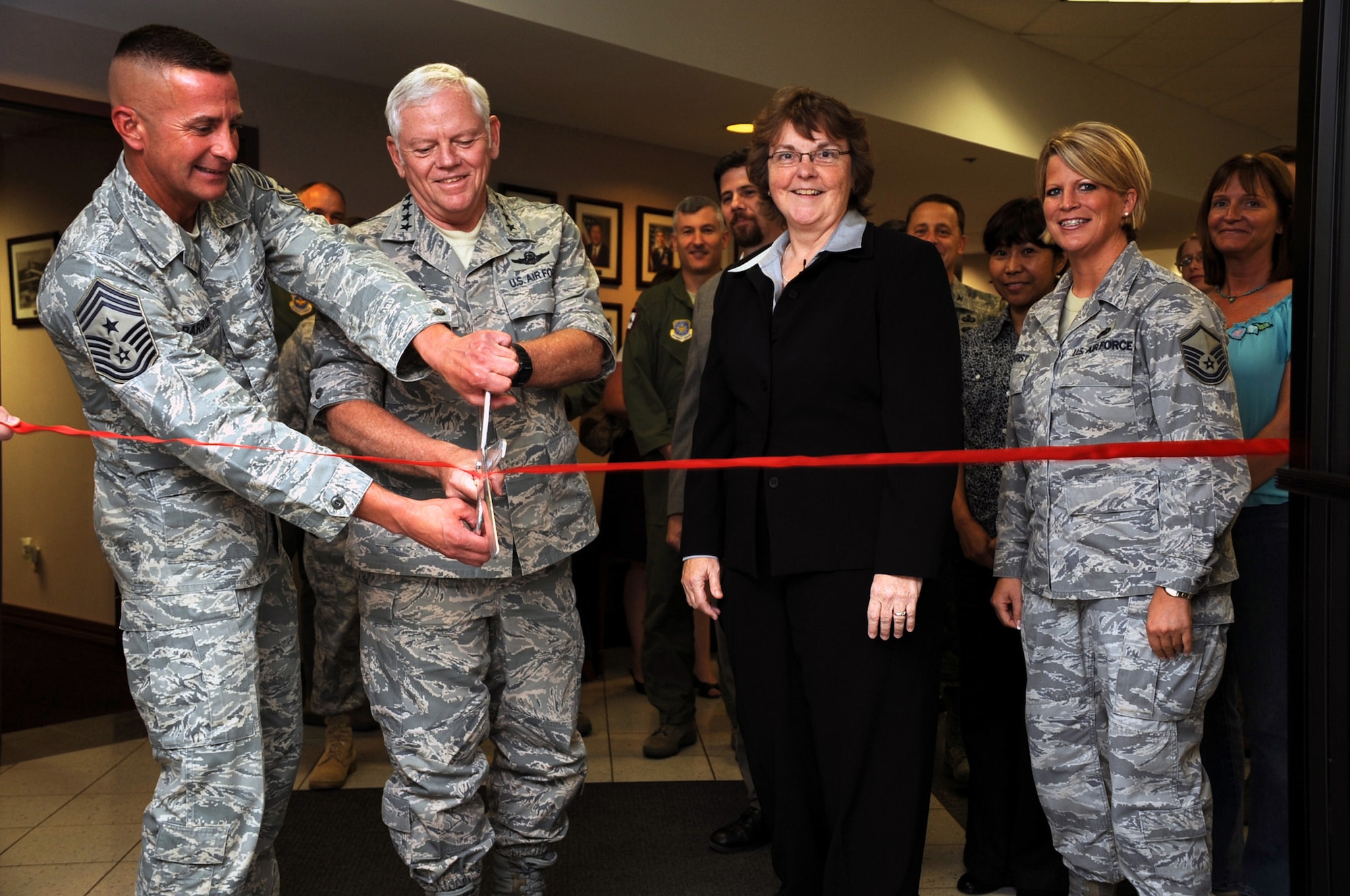 Chief Master Joseph Barron, Air Mobility Command command chief master sergeant, and Gen. Arthur Lichte, AMC commander, cut the ribbon for renovations at the Global Reach Planning Center during a special ceremony July 30, 2009, at Scott Air Force Base, Ill.  (U.S. Air Force Photo/Tech. Sgt. Scott T. Sturkol)