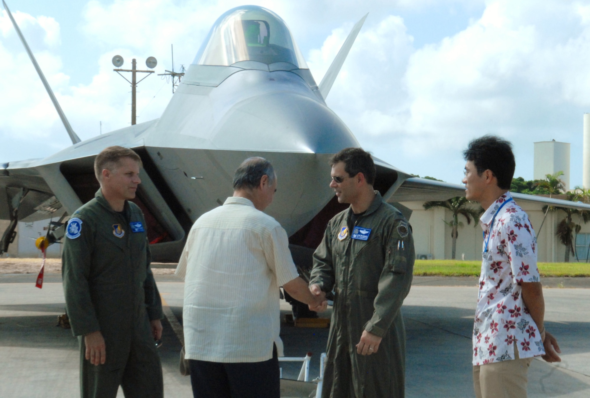 Japanese Ambassador, Sumio Tarui, receives a tour of an F-22 Raptor with Col. Kenneth Wilsbach, 18th Wing commander, and Col. Ronald Banks, 18th Operations Group commander, during a visit to Kadena Air Base, July 31. 
(U.S. Air Force photo/Tech. Sgt. Angelique Perez) 