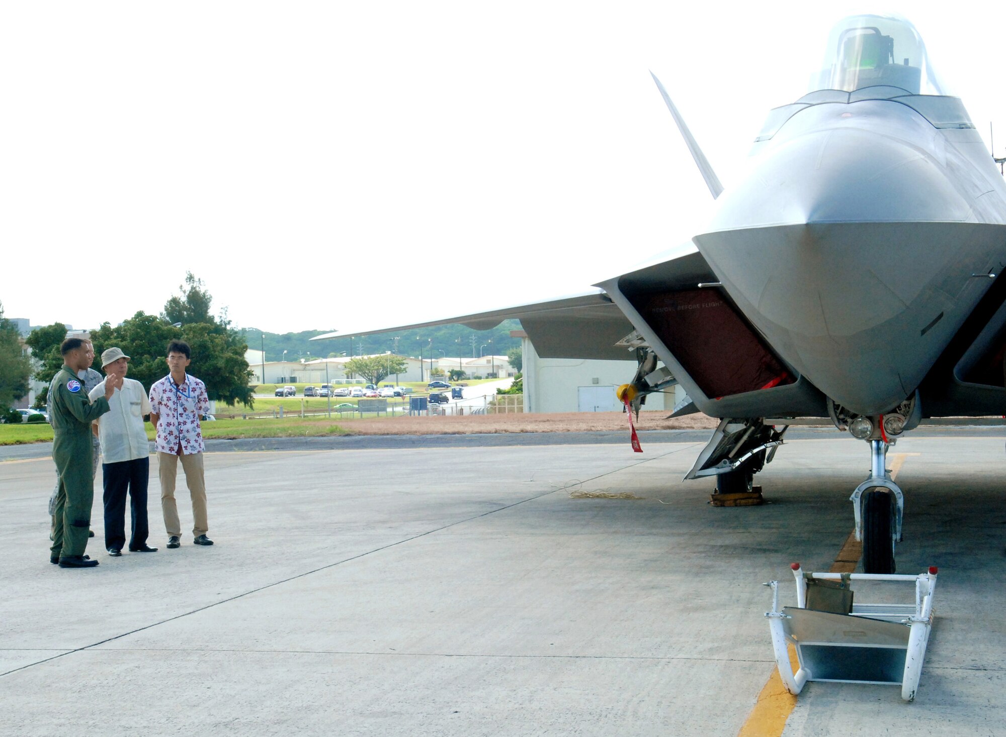 Japanese Ambassador, Sumio Tarui, receives a tour of an F-22 Raptor with Lt. Col. Adrian Spain, 94th Expeditionary Fighter Squadron commander, during a visit to Kadena Air Base, July 31. 
(U.S. Air Force photo/Tech. Sgt. Angelique Perez) 