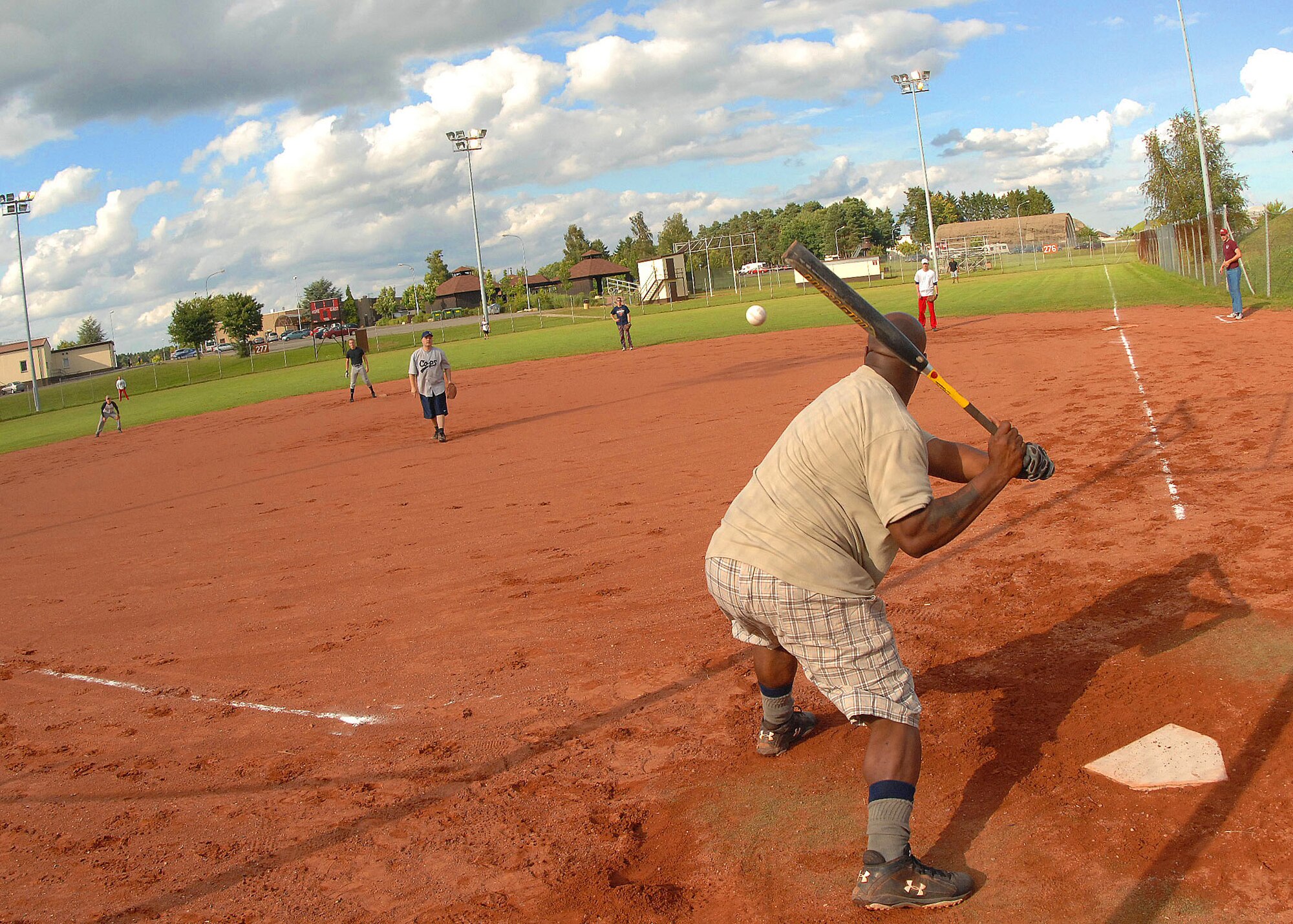 SPANGDAHLEM AIR BASE, Germany -- Dexter High, 52nd Aircraft Maintenance Squadron, takes a swing at the ball during an intramural softball game July 30. The 52nd Aircraft Maintenance Squadron finished the 2009 season with 12 wins and 8 losses. They were knocked out of a championship berth by the Security Forces team here July 30. (U.S. Air Force photo by Airman 1st Class Nick Wilson)