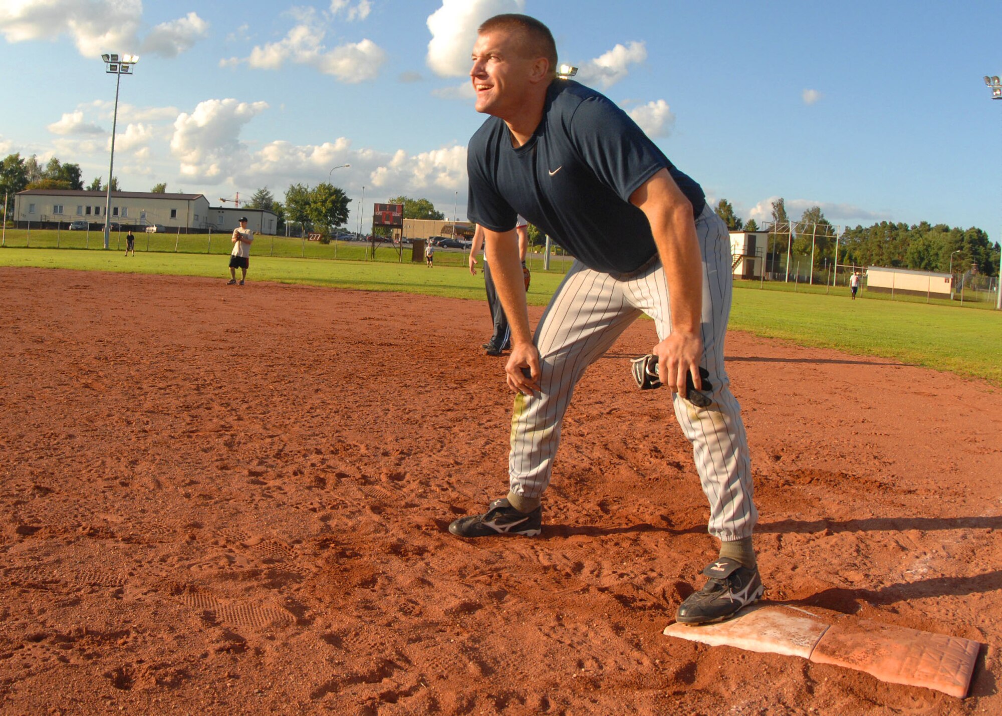 SPANGDAHLEM AIR BASE, Germany -- Michael Dean, 52nd Security Forces Squadron, waits for his chance to run to second here July 30. The Security Forces intramural softball team defeated the Aircraft Maintenance Squadron 20-15 in the National League Semifinals to play the Component Maintenance Squadron-A team for the Championship here. The Component Maintenance Squadron-A team won the 209 National League Championships by defeating SFS 14-12.  (U.S. Air Force photo by Airman 1st Class Nick Wilson)