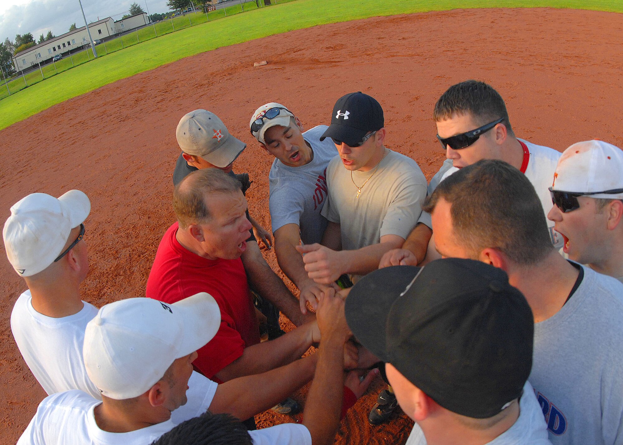 SPANGDAHLEM AIR BASE, Germany --The 52nd Component Maintenance Squadron-A team shouts their squadron chant after winning the 2009 National League Championship here July 30. The intramural softball team defeated Security Forces in the seventh inning 14-12 to win the game. (U.S. Air Force photo by Airman 1st Class Nick Wilson)