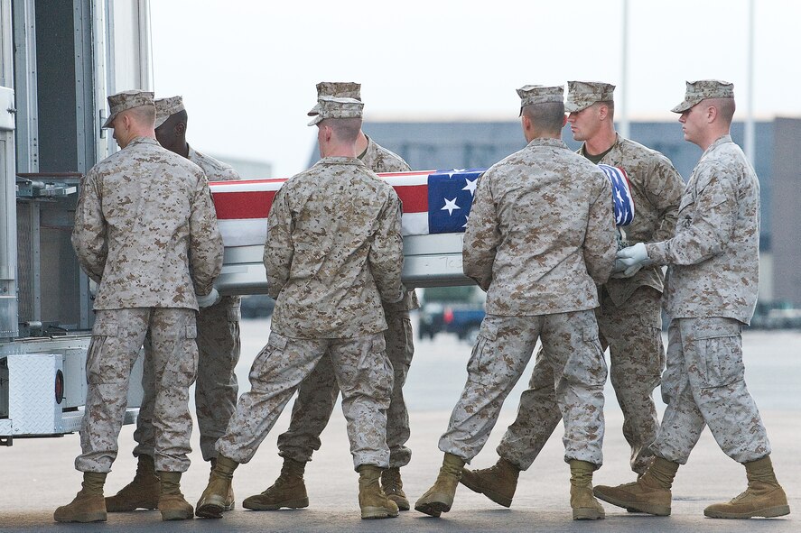 A Marine Corps carry team transfers the remains of Marine Lance Cpl. Gregory A. Posey, of Winchester, Tenn., at Dover Air Force Base, Del., August 1. Lance Cpl. Posey was assigned to 2nd Battalion, 8th Marine Regiment, 2nd Marine Division, II Marine Expeditionary Force, Camp Lejeune, N.C. (U.S. Air Force photo/Roland Balik)