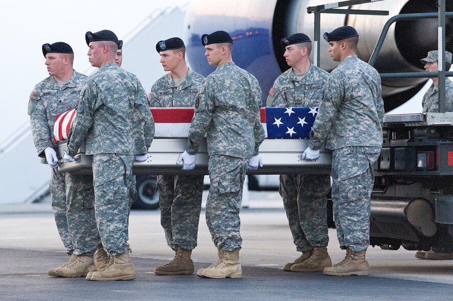 A U.S. Army carry team transfers the remains of Army Staff Sgt. Johnny Roosevelt Polk, of Gulfport, Miss., at Dover Air Force Base, Del., August 1. Staff Sgt. Polk was assigned to the 3rd Battalion, 82nd Field Artillery Regiment, 2nd Brigade Combat Team, 1st Cavalry Division, Fort Hood, Texas. (U.S. Air Force photo/Roland Balik)