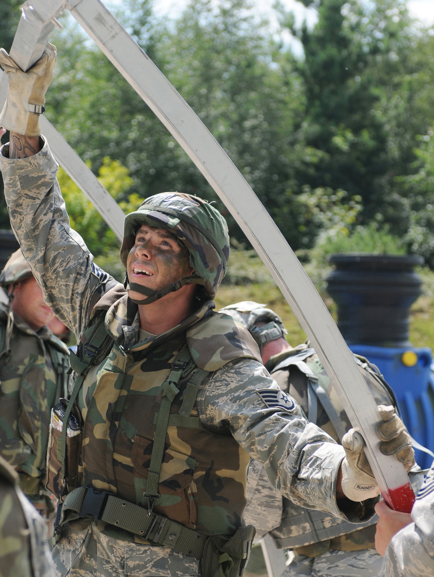 Staff Sgt. Johnathon Korenek helps assemble a small shelter system Aug. 1 during Silver Flag, a week-long training exercise at Ramstein Air Base, Germany.  Silver Flag gives participants the basic contingency skills to set up a bed-down operation anywhere in the world.  Sergeant Korenek is with the 31st Civil Engineer Squadron at Aviano Air Base, Italy.  (U.S. Air Force photo/Tech. Sgt. Sean Mateo White)