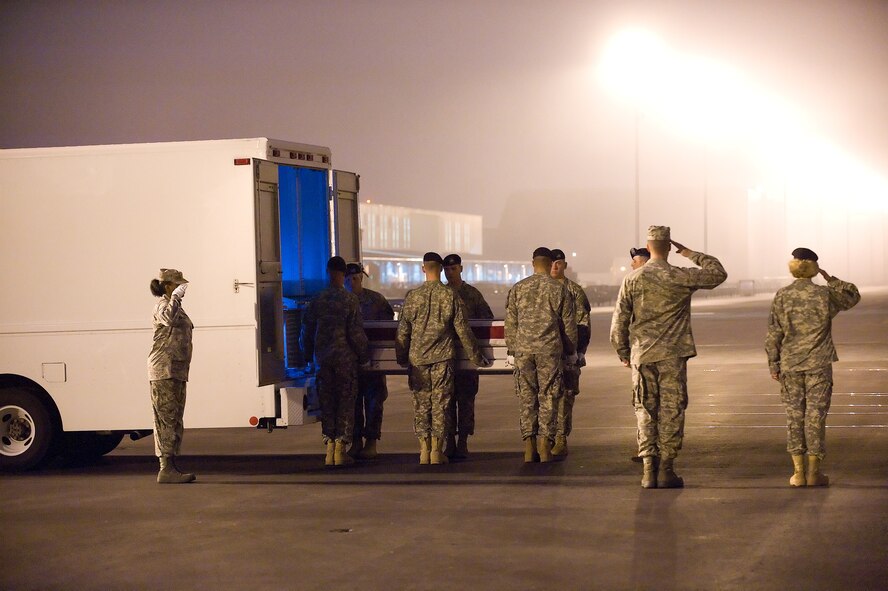 A U.S. Army carry team transfers the remains of Army Specialist Alexander J. Miller, of Clermont, Fla., at Dover Air Force Base, Del., August 2. Specialist Miller was assigned to the 1st Battalion, 32nd Infantry Regiment, 3rd Brigade Combat Team, 10th Mountain Division (Light Infantry), Fort Drum. N.Y. (U.S. Airr Force Photo/Jason Minto)
 
