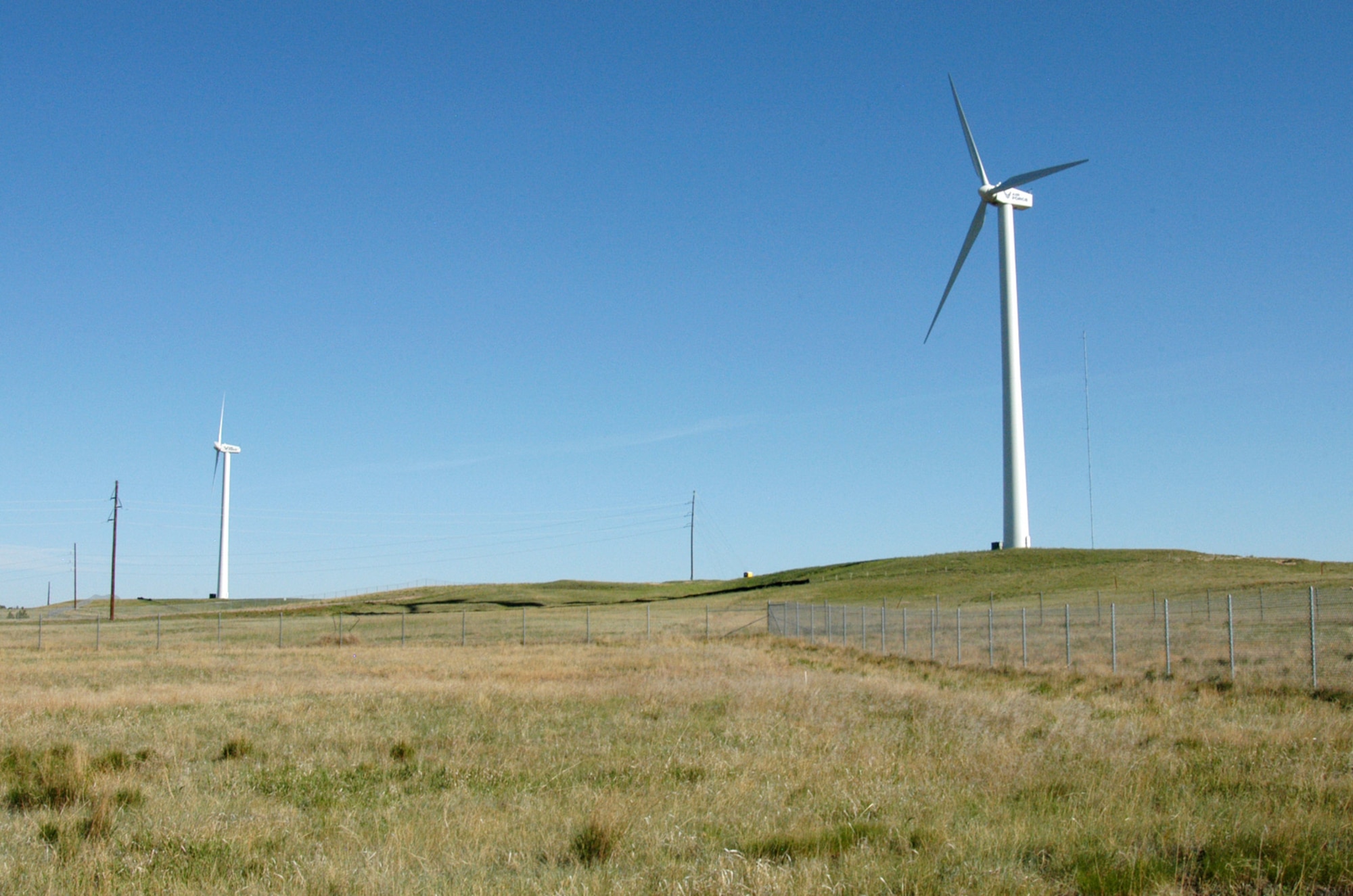 Two of the three wind turbines in operation at F.E. Warren Air Force Base, Wyo., were paid for with Energy Conservation Investment Program dollars, which is centrally managed and executed by Air Force Civil Engineer Support Agency at Tyndall AFB, Fla. (U.S. Air Force photo) 