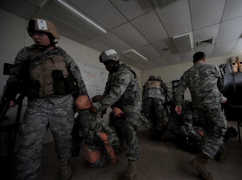 CAMP BLANDING, Fla. -- Airmen from the 93rd Air Ground Operations Wing, a tenant wing at Moody Air Force Base, Ga., along with other combat weather Airmen assigned at various installations, carry simulated victims during a combat lifesaver skills course here July 17. During the training, Airmen from non-medical Air Force Specialty Codes are taught advanced first-aid and lifesaving procedures. (U.S. Air Force photo by Senior Airman Gina Chiaverotti-Paige)