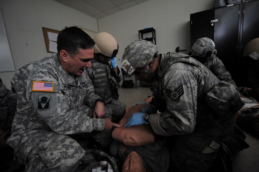 CAMP BLANDING, Fla. -- Sgt. 1st Class Gregory Mirones, Regional Training Institute medical training NCO in-charge, 3rd Battalion, 211th Regiment, at Camp Blanding, explains a training scenario to members from the 93rd Air Ground Operations Wing, a tenant wing at Moody Air Force Base, Ga., during a combat lifesaver skills course here July 17. The training included advanced first-aid and lifesaving procedures for use while in a deployed environment.  (U.S. Air Force photo by Senior Airman Gina Chiaverotti-Paige)