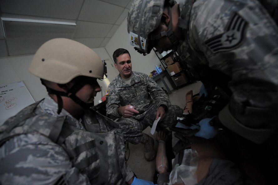 CAMP BLANDING, Fla. -- Sgt. 1st Class Gregory Mirones, Regional Training Institute medical training NCO in-charge, 3rd Battalion, 211th Regiment, at Camp Blanding, provides Airmen from the 93rd Air Ground Operations Wing, a tenant wing at Moody Air Force Base, Ga., with various scenarios during a combat lifesaver skills course here July 17. During the training, combat weather Airmen are taught advanced first-aid and lifesaving procedures. (U.S. Air Force photo by Senior Airman Gina Chiaverotti-Paige)