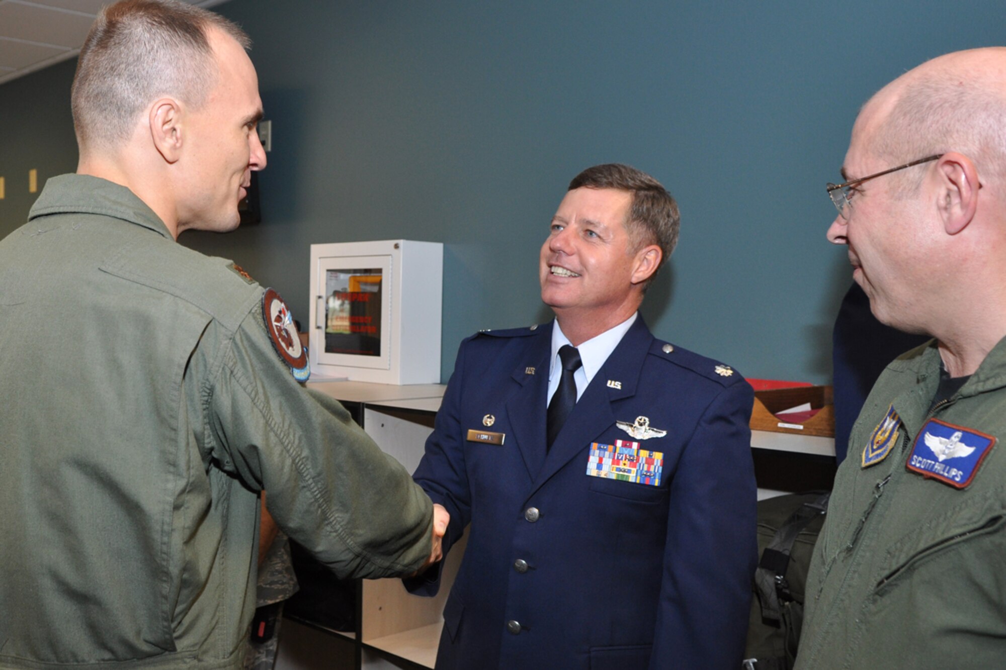 Colonel Select Keith Schultz takes an opportunity to say farewell to his former squadron members after a change of command ceremony Sunday, August 2, 2009, at the 93rd Bomb Squadron Headquarters building on Barksdale Air Force Base, La. Lt. Col. Joseph Jones, commander, 93rd Bomb Squadron, took the reins from Colonel Schultz, who is leaving the 93rd BS to take a position with the Pacific Air Forces at Hickam Air Force Base, Hawaii. The 93rd BS recently was given primary responsibility for the Air Force’s B-52 formal training mission after receiving 11 additional B-52s, approximately 320 maintainers and 40 operations personnel from the 2nd Bomb Wing.  This move placed the 93rd in a partnership with the Regular Air Force under the total force initiative. (U.S. Air Force photo/Tech. Sgt. Jeff Walston)