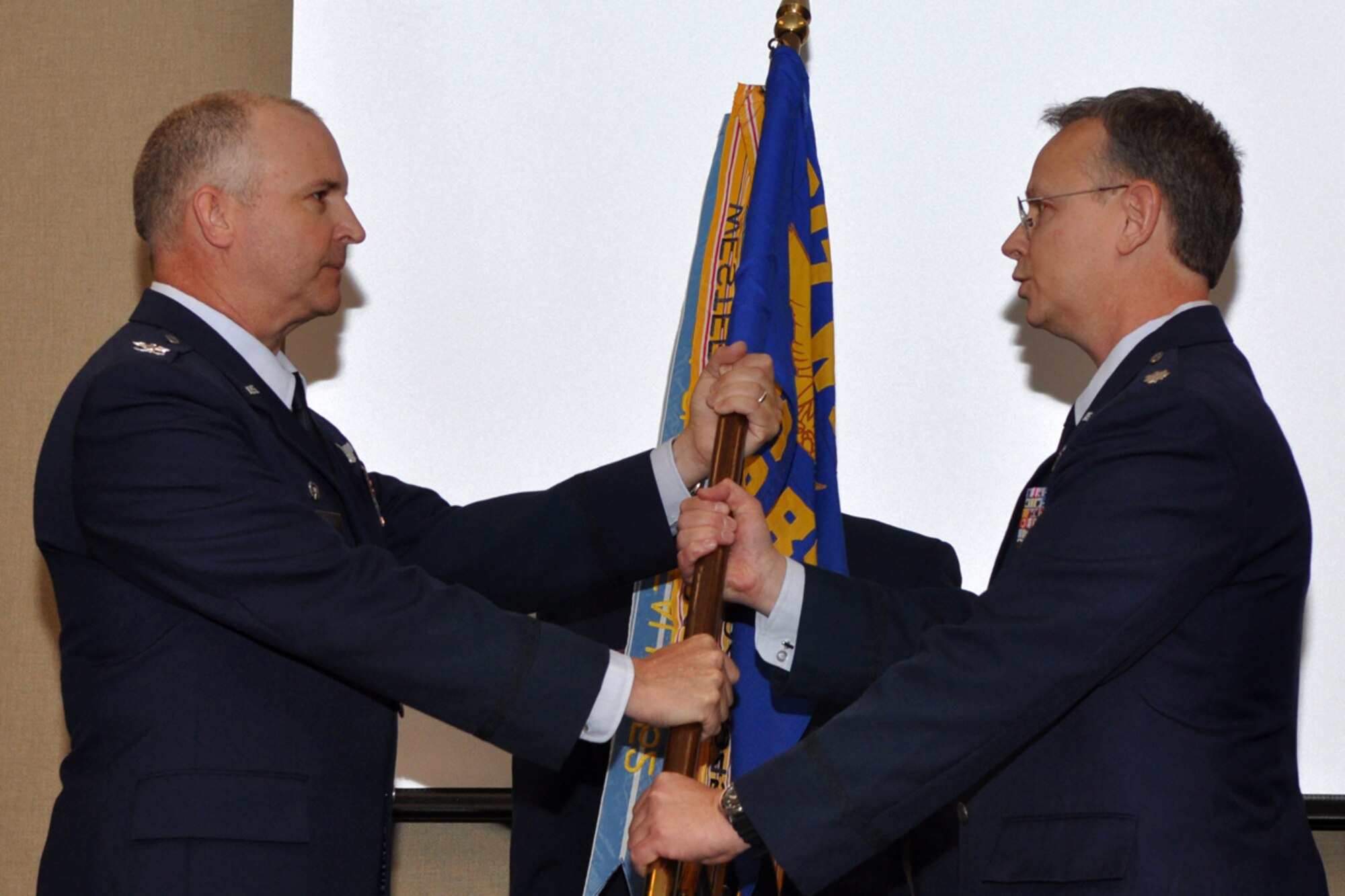 With the passing of the guidon from Colonel Robert J. Nordberg, commander, 917th Operations Group, 917th Wing, Lt. Col. Joseph Jones assumes command of the 93rd Bomb Squadron during a change of command ceremony held Sunday, August 2, 2009, at the 93rd Bomb Squadron Headquarters building on Barksdale Air Force Base, La. Colonel Jones took the reins from Colonel Select Keith Schultz, who is leaving the 93rd BS to take a position with the Pacific Air Forces at Hickam Air Force Base, Hawaii. Colonel Jones, who is also an Internal Medicine Physician, at Tri State Medical Clinic in Shreveport, La., becomes the 9th commander of the 93rd BS at Barksdale. He will be the first who is also a doctor. (U.S. Air Force photo/Tech. Sgt. Jeff Walston)