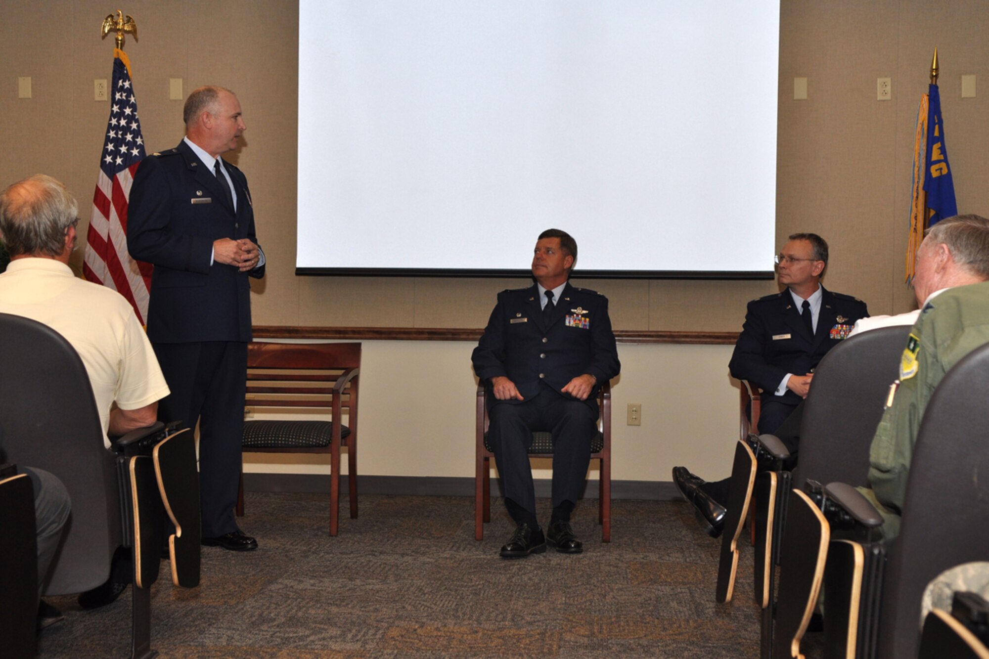Colonel Robert J. Nordberg, commander, 917th Operations Group, 917th Wing, Barksdale AFB, La., praises both Colonel Select Keith Schultz and Lt. Col. Joseph Jones, during a change of command ceremony held Sunday, August 2, 2009, at the 93rd Bomb Squadron, at Barksdale Air Force Base, La. Colonel Jones (right) took the reins from Colonel Select Keith Schultz, who is leaving the 93rd BS to take a position with the Pacific Air Forces at Hickam Air Force Base, Hawaii. Colonel Jones, who is also an Internal Medicine Physician, at Tri State Medical Clinic in Shreveport, La., becomes the 9th commander of the 93rd BS at Barksdale. He will be the first who is also a doctor. (U.S. Air Force photo/Tech. Sgt. Jeff Walston)