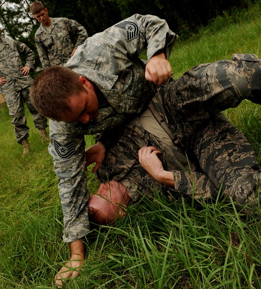 MOODY AIR FORCE BASE, Ga. -- Tech. Sgt. Iain Stewart, 93rd Air Ground Operations Wing survival, evasion, resistance and escape instructor, demonstrates a basic movement used in hand-to-hand combat, during the air liaison officer selection course held here July 24. (U.S. Air Force photo by Airman 1st Class Joshua Green)