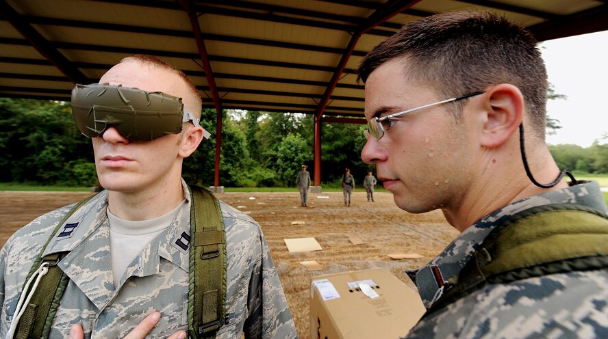 MOODY AIR FORCE BASE, Ga. -- Capt. Matthew Kealy and 2nd Lt. Michael Brittner, both candidates from the air liaison officer selection course, participate in a leadership reaction training exercise held at the 820th Security Forces Group military operations in urban terrain village here July 24. (U.S. Air Force photo by Airman 1st Class Joshua Green