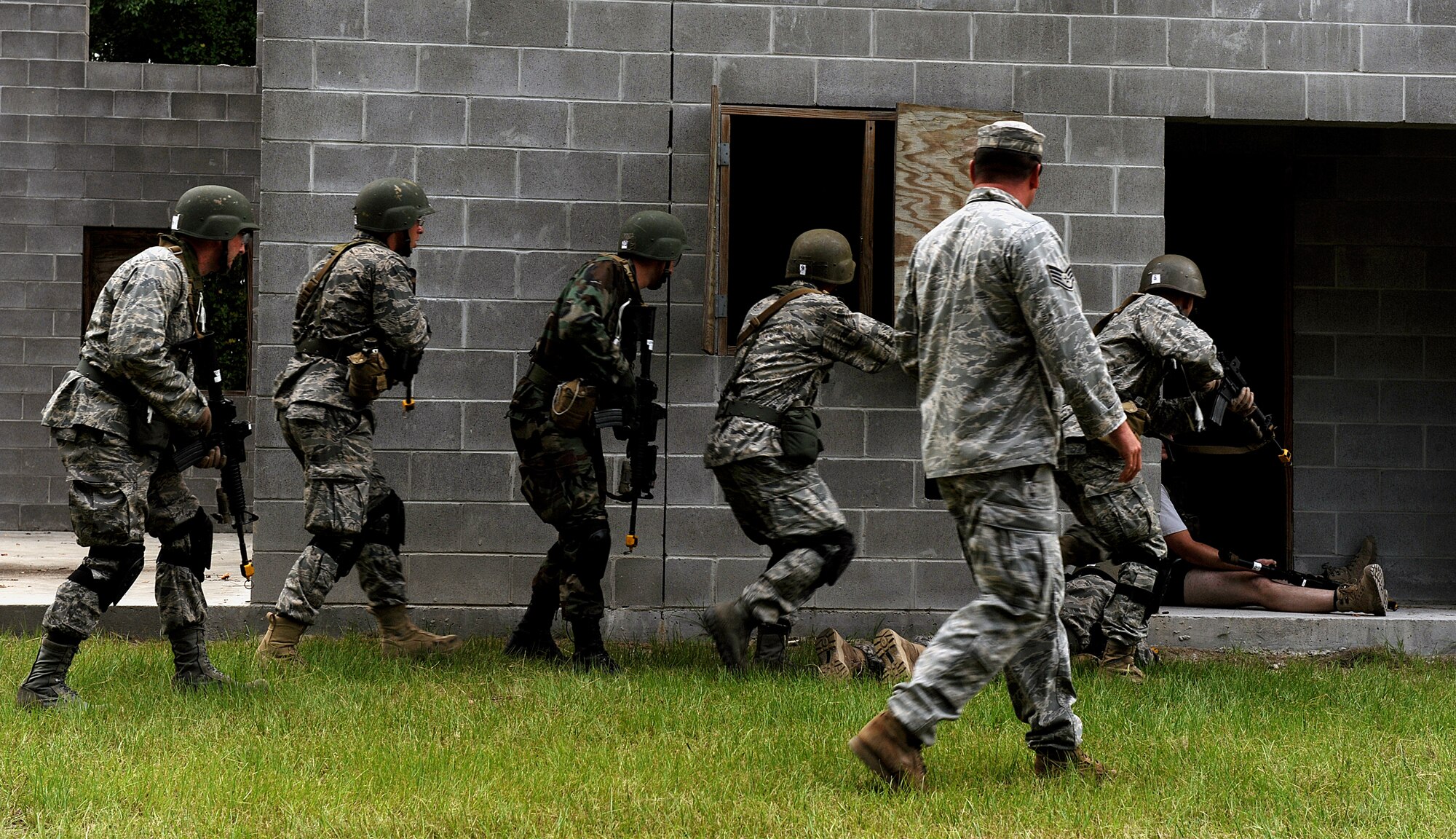 MOODY AIR FORCE BASE, Ga. -- Candidates from the air liaison officer selection course participate in a leadership assignment during training held at the 820th Security Forces Group military operations in urban terrain village here July 23. The candidates were assigned a tasking to infiltrate the village and gather information from the local leader. (U.S. Air Force photo by Airman 1st Class Joshua Green) 