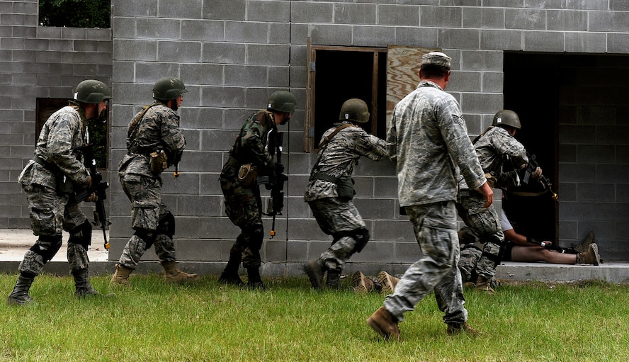 MOODY AIR FORCE BASE, Ga. -- Candidates from the air liaison officer selection course participate in a leadership assignment during training held at the 820th Security Forces Group military operations in urban terrain village here July 23. The candidates were assigned a tasking to infiltrate the village and gather information from the local leader. (U.S. Air Force photo by Airman 1st Class Joshua Green) 