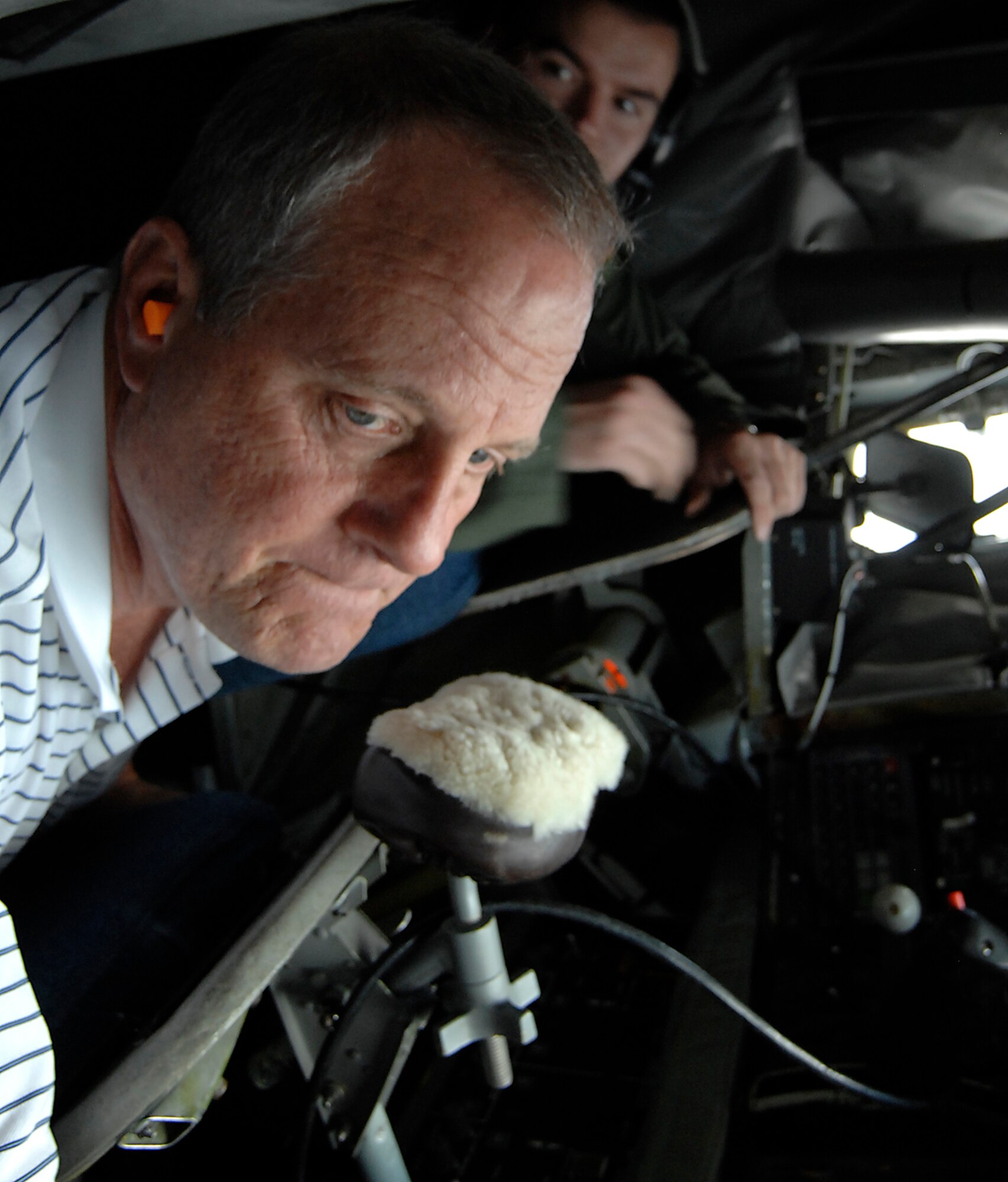 Mr. Dave Wenz learns what it is like to be a boom operator of a KC-135 Stratotanker during an aerial refueling mission in late July 2009. Mr. Wenz is a Special Olympics Board member and the honorary commander of the 931st Civil Engineer Squadron, an Air Force Reserve unit at McConnell Air Force Base, Kan. He and other honorary commanders of units at McConnell were invited to see a KC-135 mission given to the 22nd Air Refueling Wing, the active-duty host unit at the base. (U.S. Air Force photo/Senior Airman Laura Suttles)