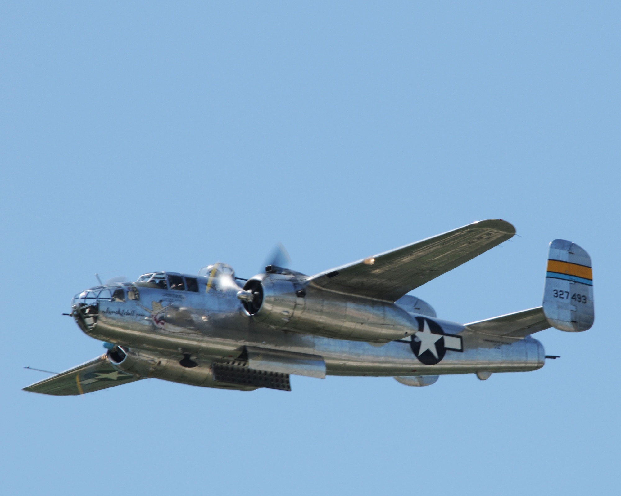 A B25J Mitchell, a World War II bomber, Flies high over the crowds at the Sioux Gateway Airport / Col. Bud Day Field, in Sioux City, Iowa.  This B-25, named "Miss Mitchell" flew 130 missions over North Africa & Italy, will be on display at the "Air and Ag Show" hosted by the 185th Air Refueling Wing.  Official Air Force Photo by: MSgt. Bill Wiseman (released)