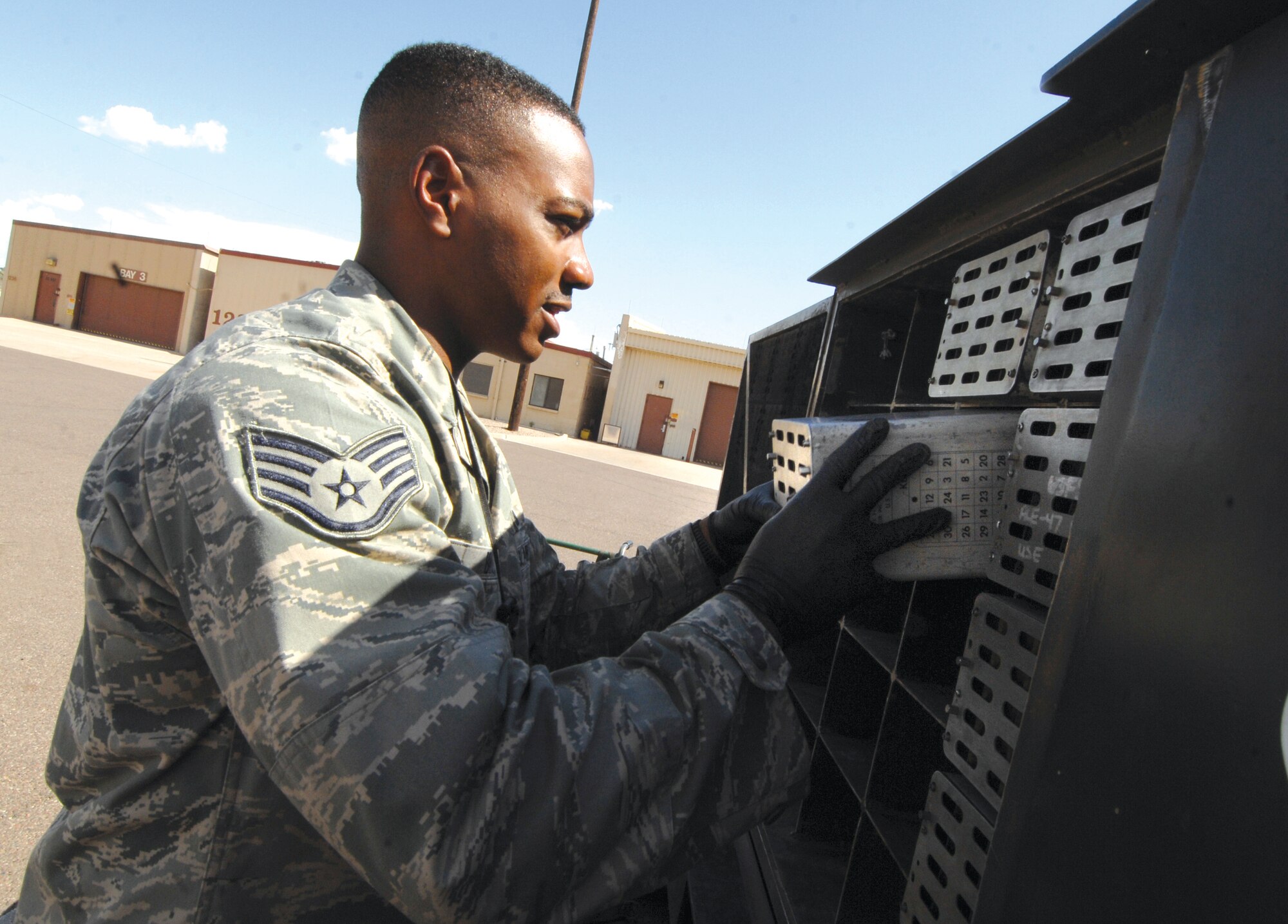 Staff Sgt. Christopher Broyles, 56th Equipment Maintenance Squadron munitions inspector, processes spent flare and chaff. (U.S. Air Force photo by Tech. Sgt. Jeffrey Wolfe)