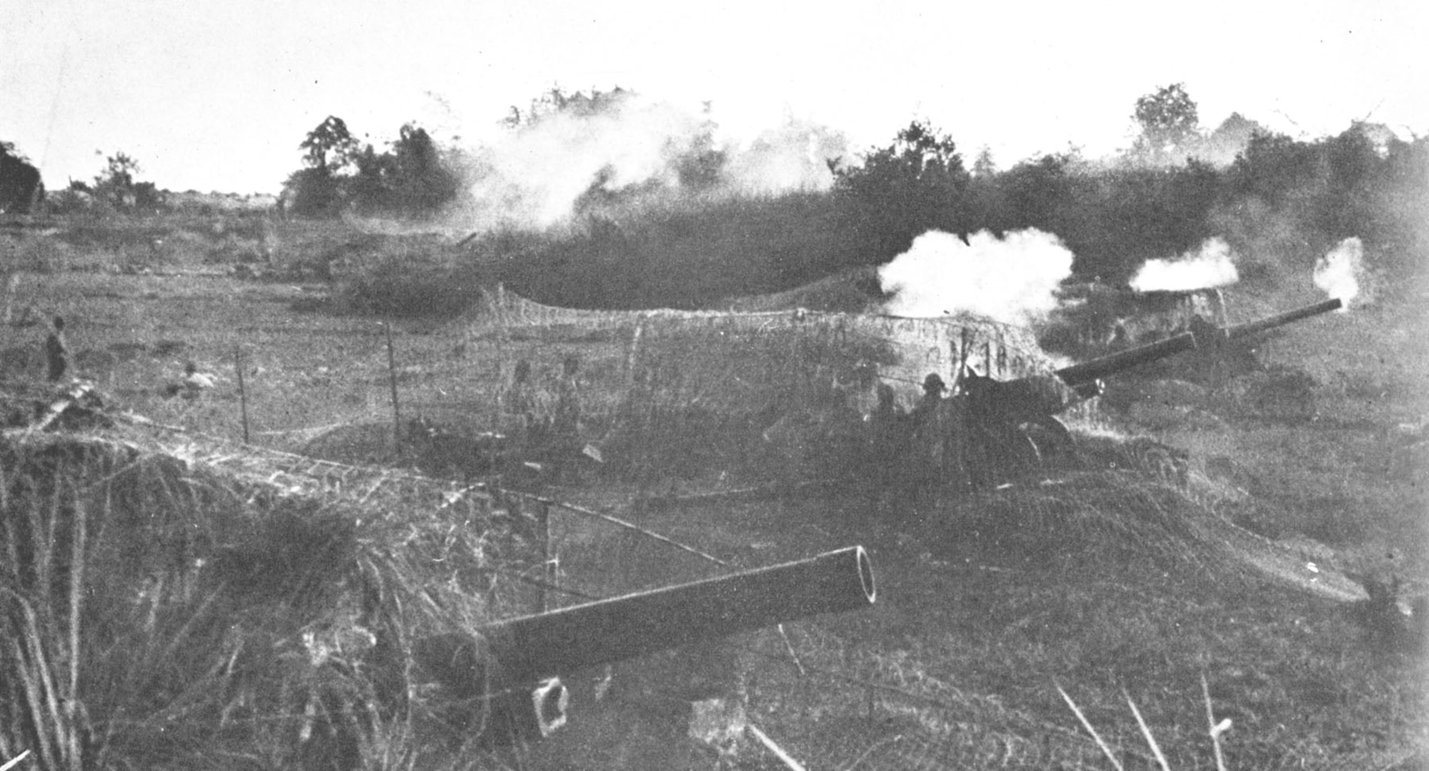 Japanese artillery firing on Bataan. PACR positions received heavy artillery bombardments leading up to the main attack in April 1942. (U.S. Air Force photo)