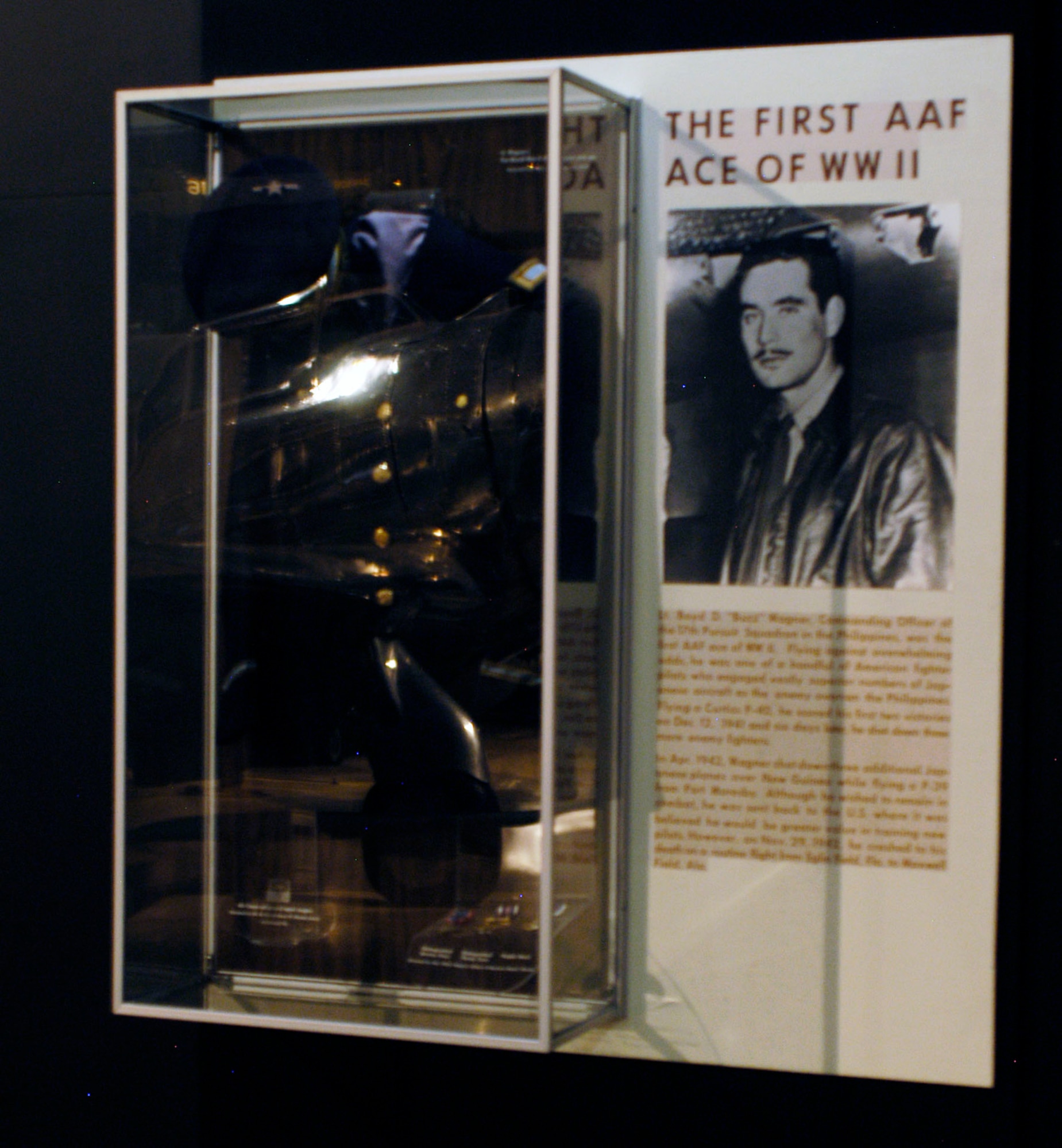 DAYTON, Ohio -- Lt. Boyd D. "Buzz" Wagner exhibit in the World War II Gallery at the National Museum of the U.S. Air Force. The exhibit includes Lt. Wagner's pre-WWII dress blouse and cap, which were donated by Maj. J. Ward Boyce. (U.S. Air Force photo)