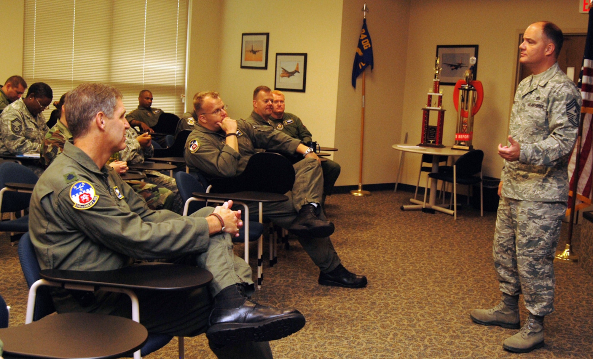 DOBBINS AIR RESERVE BASE, Ga. -- Command Chief Master Sgt. Dwight D. Badgett, Air Force Reserve Command command chief, speaks to members of the 700th Airlift Squadron here Aug. 1 about issues reservists are experiencing Air Force-wide. During his two-day immersion of the units and people of Dobbins ARB, the Chief spoke about common concerns shared by reservists and listened to questions and comments Airmen had. (Air Force photo/Airman 1st Class Chelsea Gitzen)