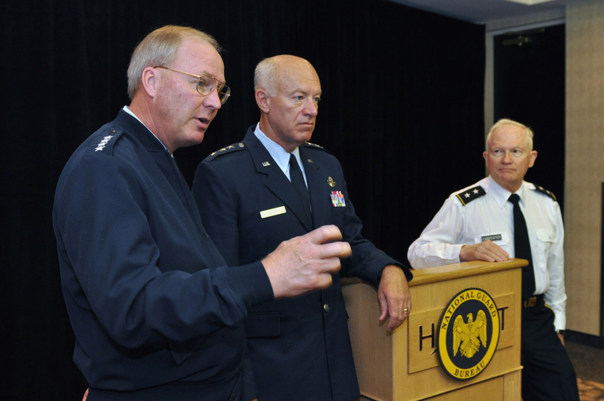 Gen. Craig R. McKinley, the chief of the National Guard Bureau; Lt. Gen. Harry M. Wyatt III, the director of the Air National Guard, and Maj. Gen. Raymond W. Carpenter, the acting director of the Army National Guard, talk with reporters during the 2009 National Guard Family Program Volunteer Workshop in Dearborn, Mich., on July 27, 2009. In an era of persistent conflict, “our National Guard and our reserve component forces are going to have to stand alongside our active-duty counterparts and contribute, just like we’ve been doing for almost eight years," McKinley said. (U.S. Army photo by Staff Sgt. Jim Greenhill) (Released)