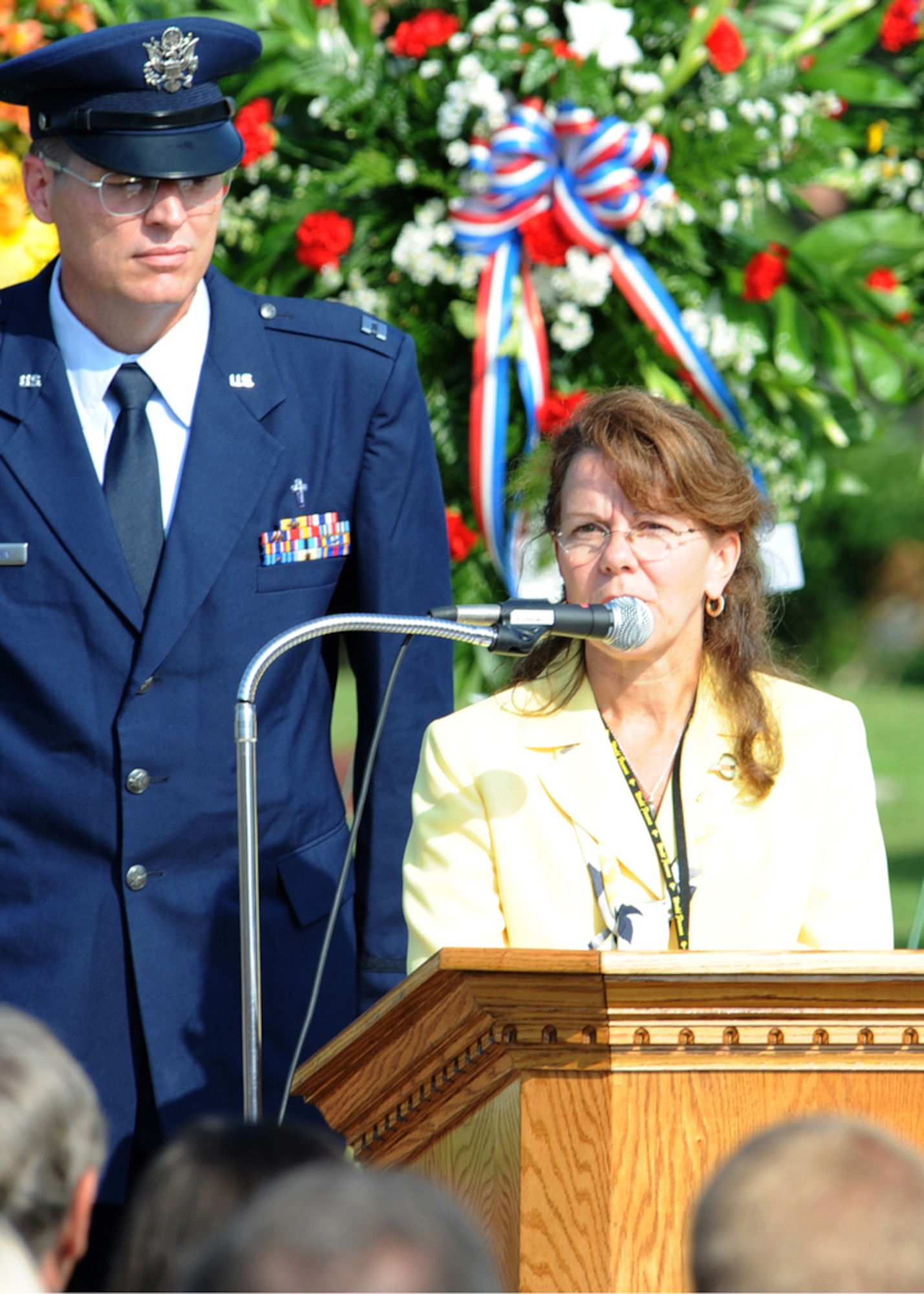 Mrs. Barbara Thomas, mother of Capt. Mark McDowell, fallen 336th Fighter Squadron member, speaks on behalf of her son at a memorial on Seymour Johnson Air Force Base, N.C., July 28, 2009. The memorial honored the fallen members, Capt. McDowell and Capt. Thomas Gramith who were killed in eastern Afghanistan when their F-15E Strike Eagle went down. (U.S. Air Force photo by Airman 1st Class Gino Reyes)	
