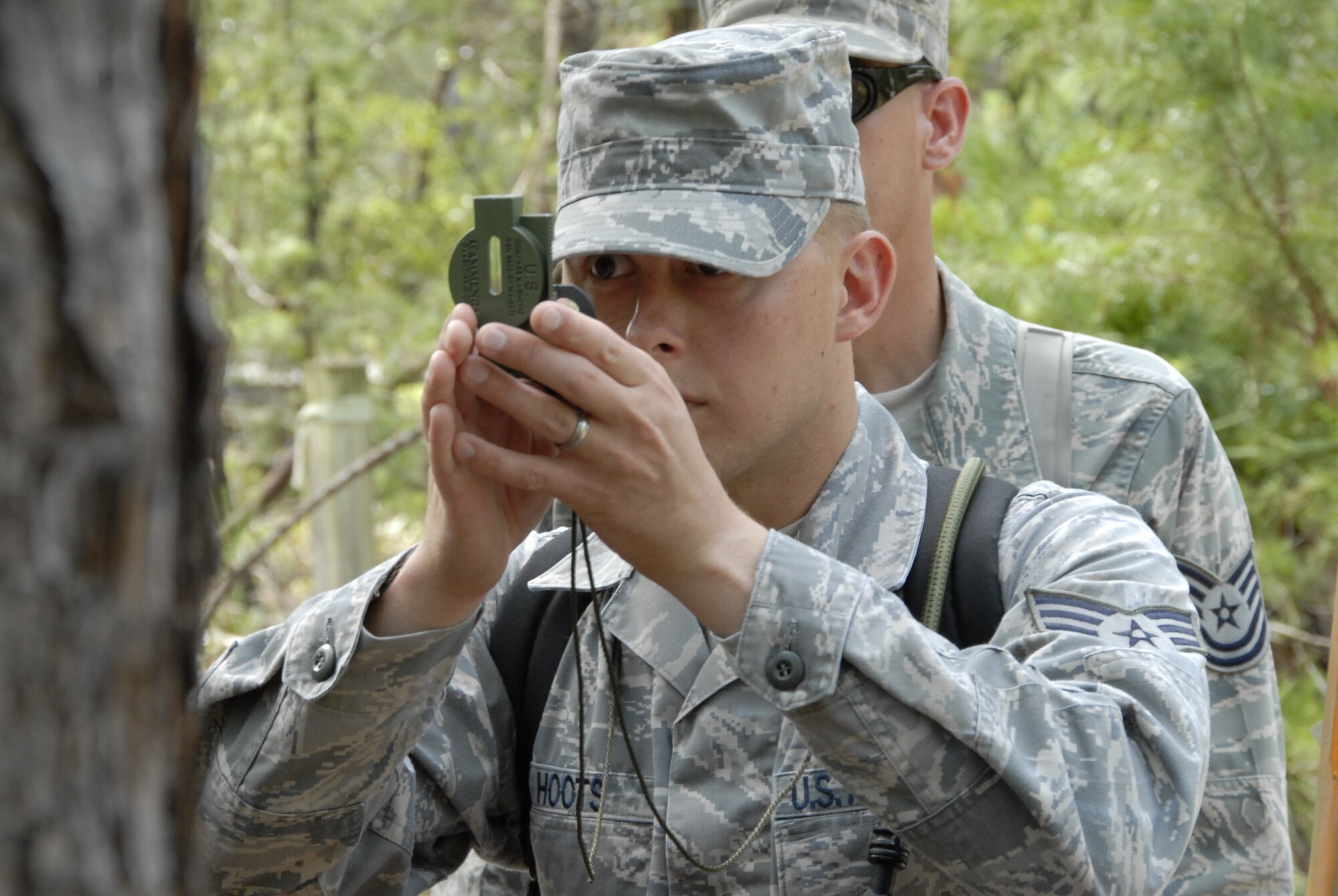 Senior Amn. Nick Hoots and Technical Sgt. John Lewis, both from the 3rd Weather Squadron, Fort Hood Texas,  use land navigation skills to find a checkpoint at Camp Blanding Joint Training Center, Fla. The land navigation is part of exercise Cyclogenesis, and training exercise designed to prepare combat weather Airmen for deployment with the Army. (Air National Guard photo by TSgt. Jeffrey Trumble)