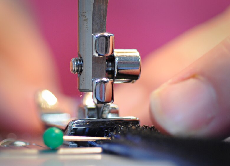 SPANGDAHLEM AIR BASE, Germany - Karen Bortner, 52nd Fighter Wing Chapel Resource Center, sews velcro into the seam of boxer shorts while volunteering for "Sew Much Comfort" July 31. Twenty-five volunteers worked from 9:30 a.m. to 2:30 p.m. to assemble 60 pairs of boxers while 22 pairs were completed. Since the program started in October 2008 more than 150 pairs of boxers have been completed to send to Landstuhl Regional Medical Center's chaplain's closet, where they will be available to wounded warriors.  (U.S. Air Force photo by Senior Airman Benjamin Wilson)