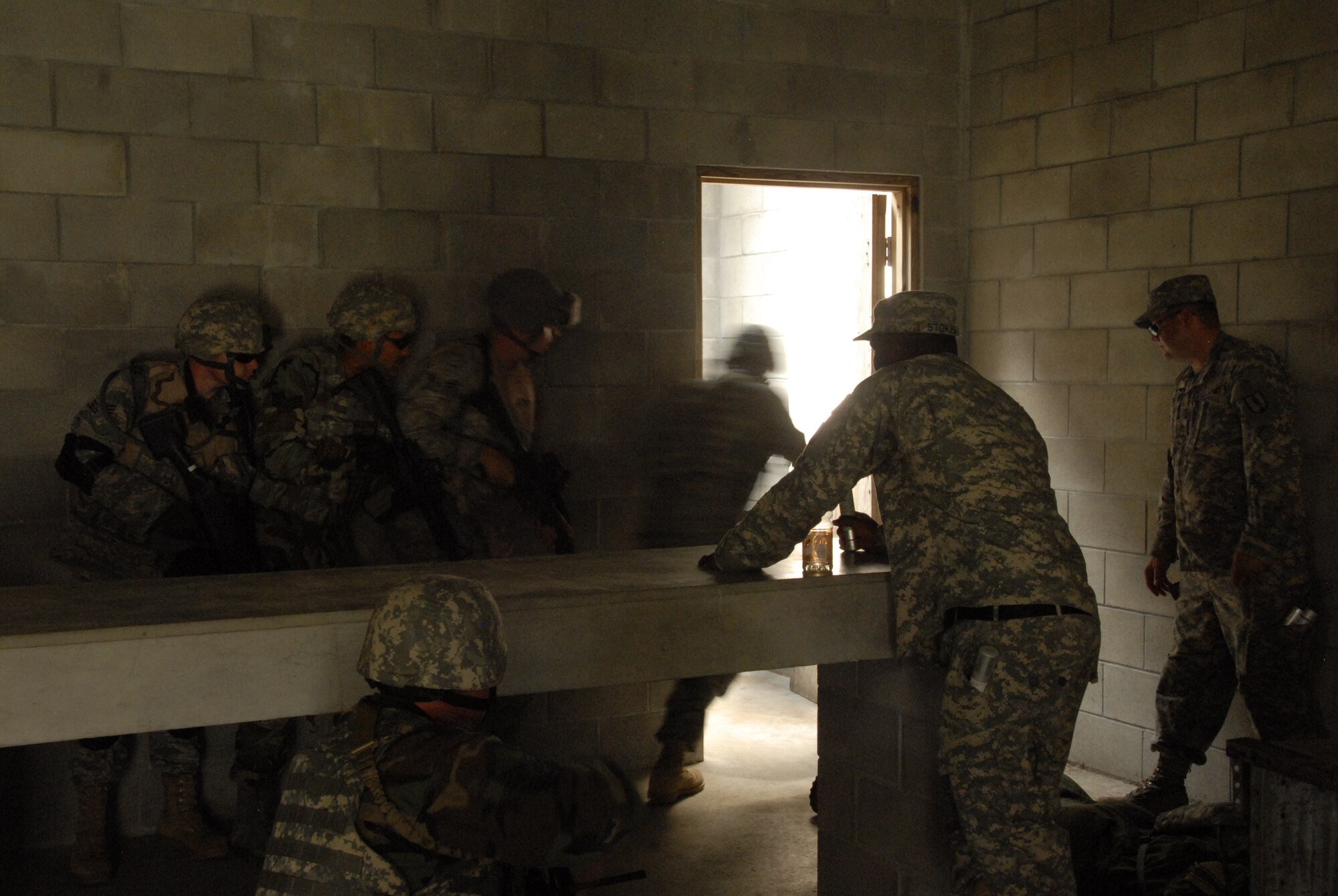 Combat weather Airmen train in building clearing skills at Camp Blanding Joint Training Center, Fla. The building clearing training is part of exercise Cyclogenesis, a training exercise designed to prepare combat weather Airmen for deployment with the Army. (Air National Guard photo by TSgt. Jeffrey Trumble)