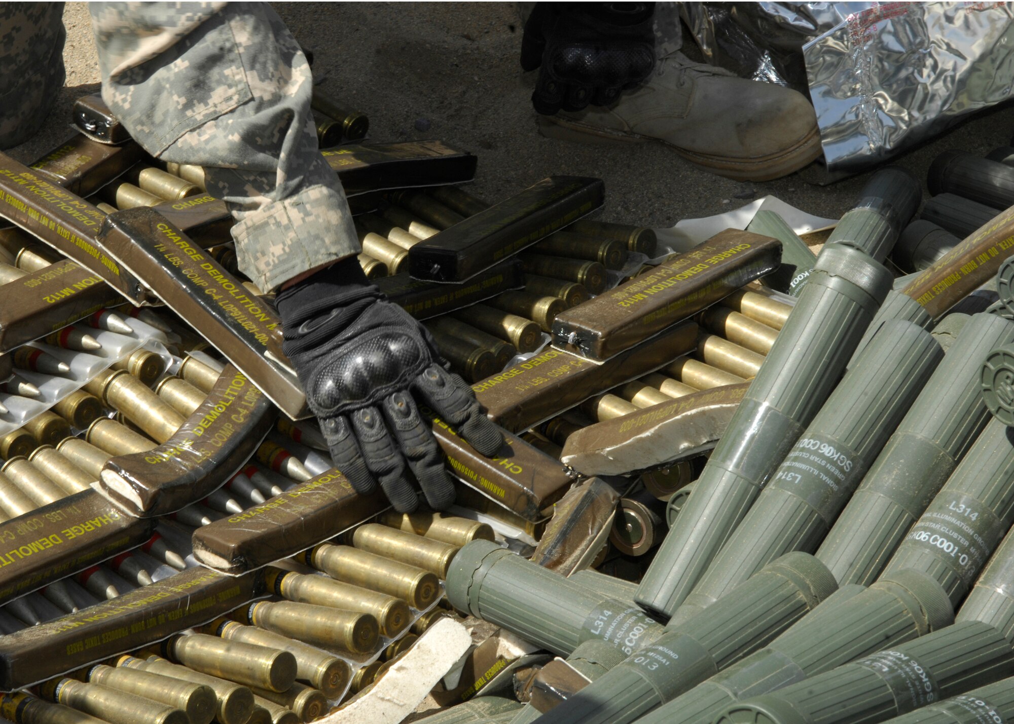 BAGRAM AIRFIELD, Afghanistan - C-4 explosives are linked on top of several hundreds of pounds of mixed ordnance, including discarded Soviet munitions from the 1970s. The cache of explosives was disposed of Aug 2. by the 755th Air Exeditionary Group, Explosive Ordnance Disposal flight on a range several miles away from Bagram Airfield. (U.S. Air Force photo/Senior Airman Susan Tracy)