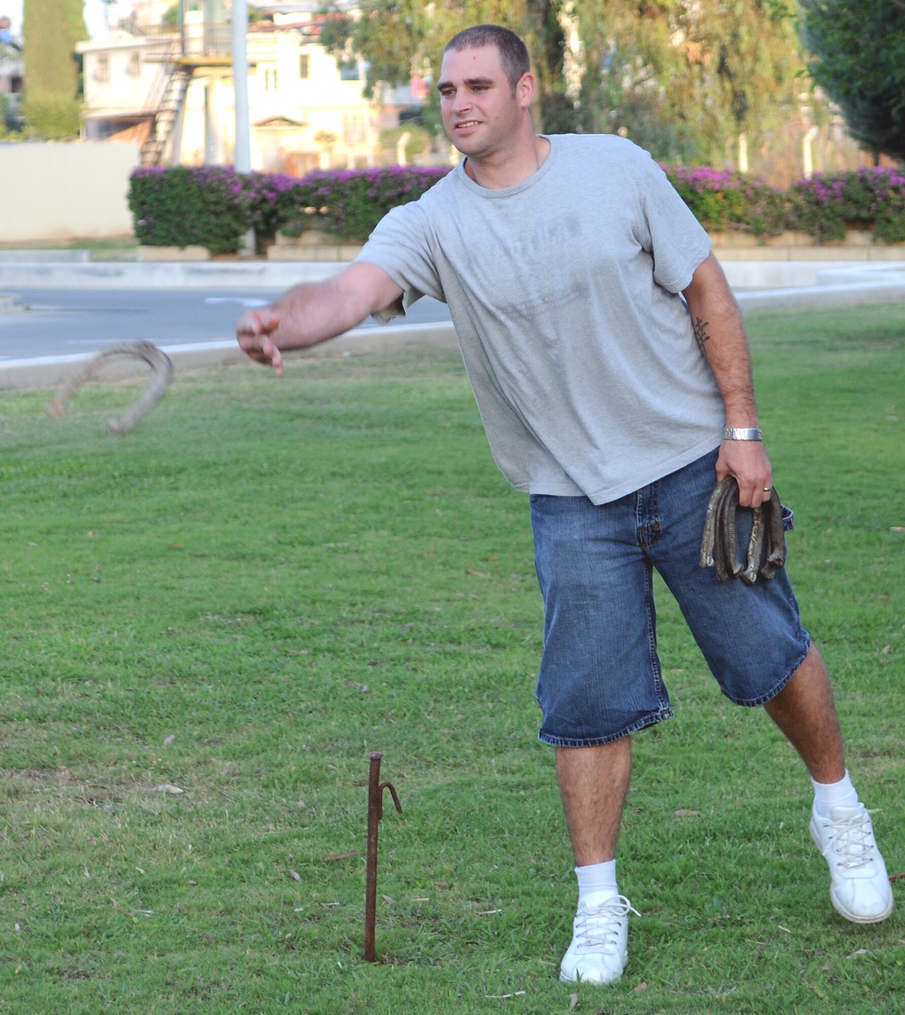 Staff Sgt. Bruce Shoffner, a 39th Maintenance Group resource advisor, attempts to earn a “ringer” during a horseshoe tournament Thursday, July 30, 2009 at the consolidated club, Incirlik Air Base, Turkey. Eight people participated in the tourney that was hosted by the club. Charlotte Kinser, 39th Force Support Squadron civilian personnel, won the first-place prize of $150. (U.S. Air Force photo/Senior Airman Alex Martinez)